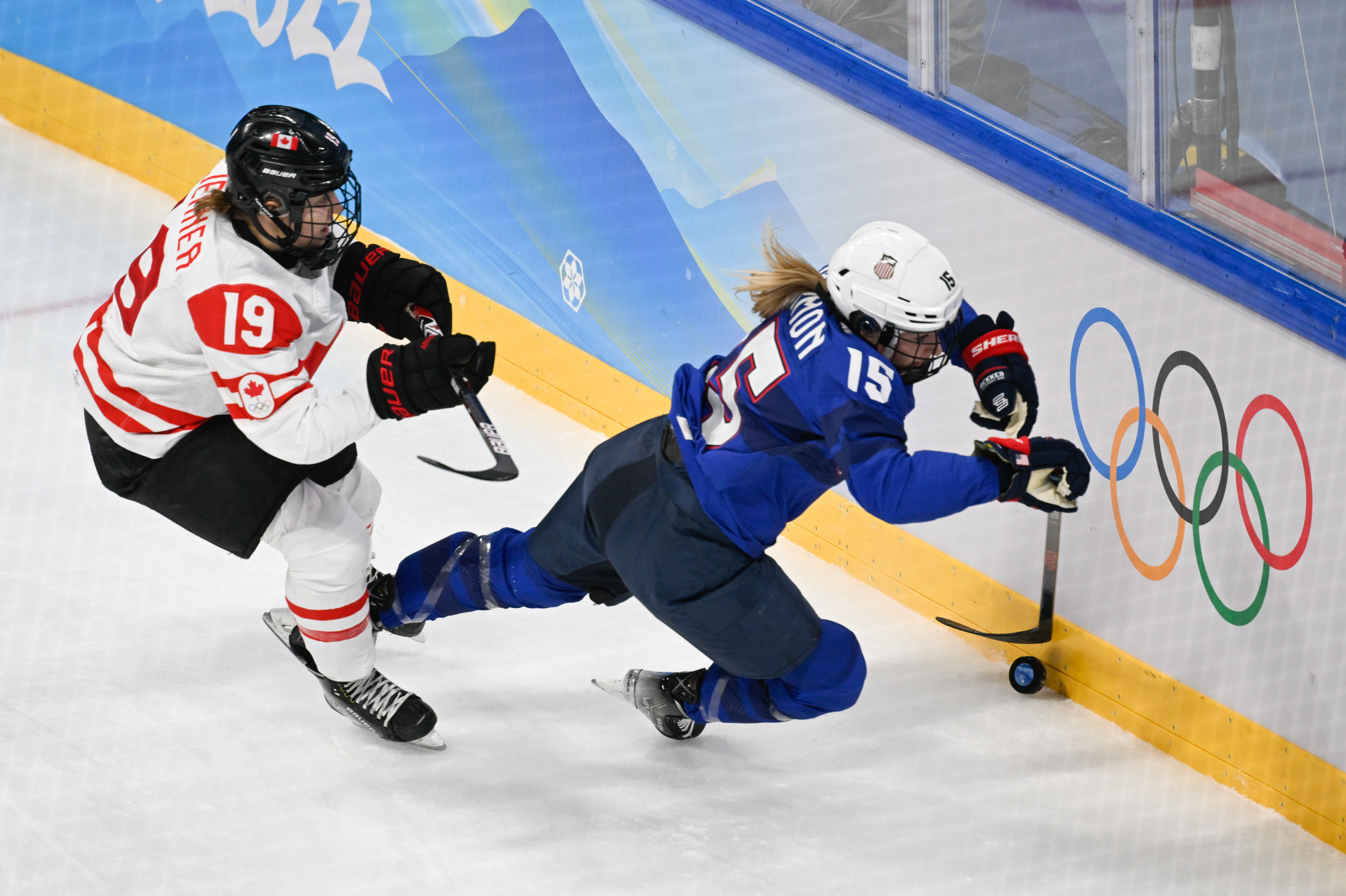 BEIJING, CHINA - FEBRUARY 08: Brianne Jenner of Canada and Savannah Harmon of USA battle for the puck in the match between USA and Canada during the Beijing 2022 Winter Olympics at National Indoor Stadium on February 8, 2022 in Beijing, China. (Photo by Mario Hommes/DeFodi Images via Getty Images)