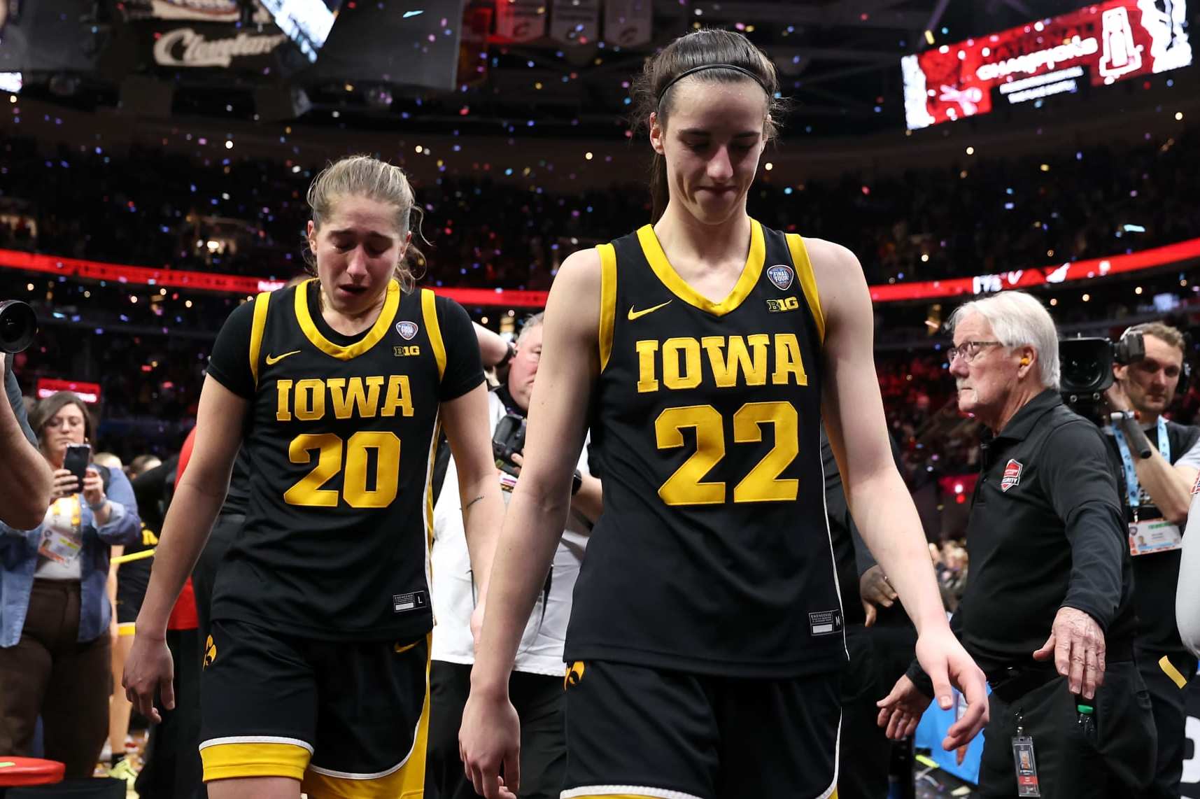 CLEVELAND, OHIO - APRIL 07: Caitlin Clark #22 and Kate Martin #20 of the Iowa Hawkeyes walk off the court after losing to the South Carolina Gamecocks in the 2024 NCAA Women's Basketball Tournament National Championship at Rocket Mortgage FieldHouse on April 07, 2024 in Cleveland, Ohio. Iowa beat South Carolina 87-75. (Photo by Steph Chambers/Getty Images)
