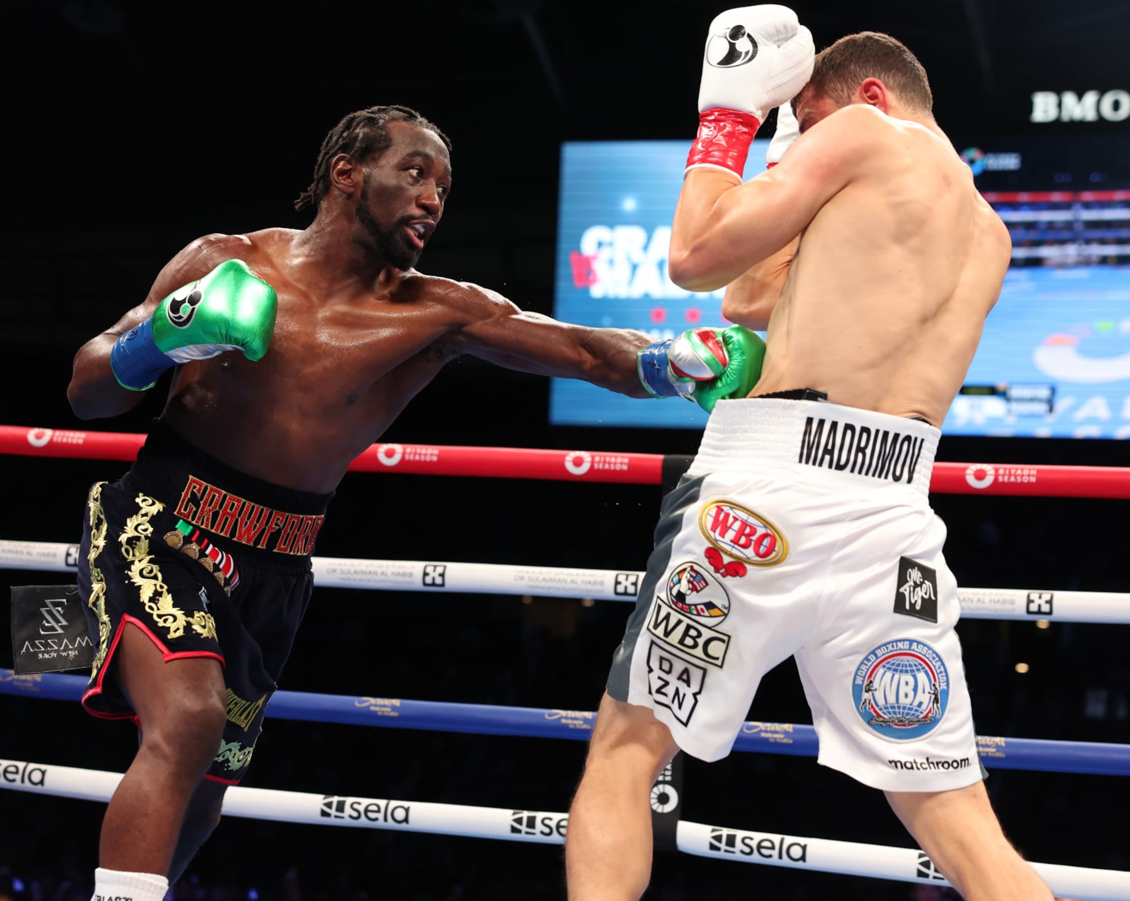 LOS ANGELES, CALIFORNIA - AUGUST 03: Terence Crawford (black and gold shorts) and Israil Madrimov (white shorts) fight during their WBA World Interim WBO World Super Welterweight Title Contest, at BMO Stadium on August 3, 2024 in Los Angeles, California. (Photo by Mark Robinson/Matchroom Boxing/Getty Images)