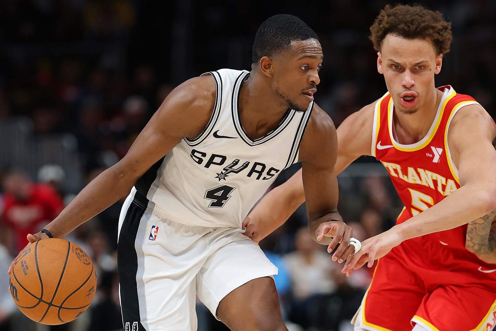 ATLANTA, GEORGIA - FEBRUARY 05: De'Aaron Fox #4 of the San Antonio Spurs drives against the Dyson Daniels #5 of the Atlanta Hawks during the fourth quarter at State Farm Arena on February 05, 2025 in Atlanta, Georgia. NOTE TO USER: User expressly acknowledges and agrees that, by downloading and or using this photograph, User is consenting to the terms and conditions of the Getty Images License Agreement. (Photo by Kevin C. Cox/Getty Images)