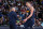 DENVER, CO - DECEMBER 15: Head Coach Michael Malone of the Denver Nuggets talks with Nikola Jokic #15 during the game against the Minnesota Timberwolves on December 15, 2021 at the Ball Arena in Denver, Colorado. NOTE TO USER: User expressly acknowledges and agrees that, by downloading and/or using this Photograph, user is consenting to the terms and conditions of the Getty Images License Agreement. Mandatory Copyright Notice: Copyright 2021 NBAE (Photo by Garrett Ellwood/NBAE via Getty Images)