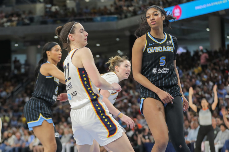 CHICAGO, IL - JUNE 23: Angel Reese #5 of the Chicago Sky and Caitlin Clark #22 of the Indiana Fever look on during the second half against the Chicago Sky on June 23, 2024 at Wintrust Arena in Chicago, Illinois. (Photo by Melissa Tamez/Icon Sportswire via Getty Images)