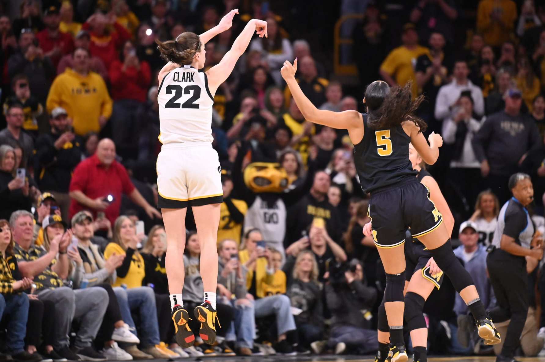IOWA CITY, IA - FEBRUARY 15: Iowa guard Caitlin Clark (22) puts up three-point shot during a women's college basketball game between the Michigan Wolverines and the Iowa Hawkeyes on February 15, 2024, at Carver-Hawkeye Arena in Iowa City, IA. (Photo by Keith Gillett/Icon Sportswire via Getty Images)