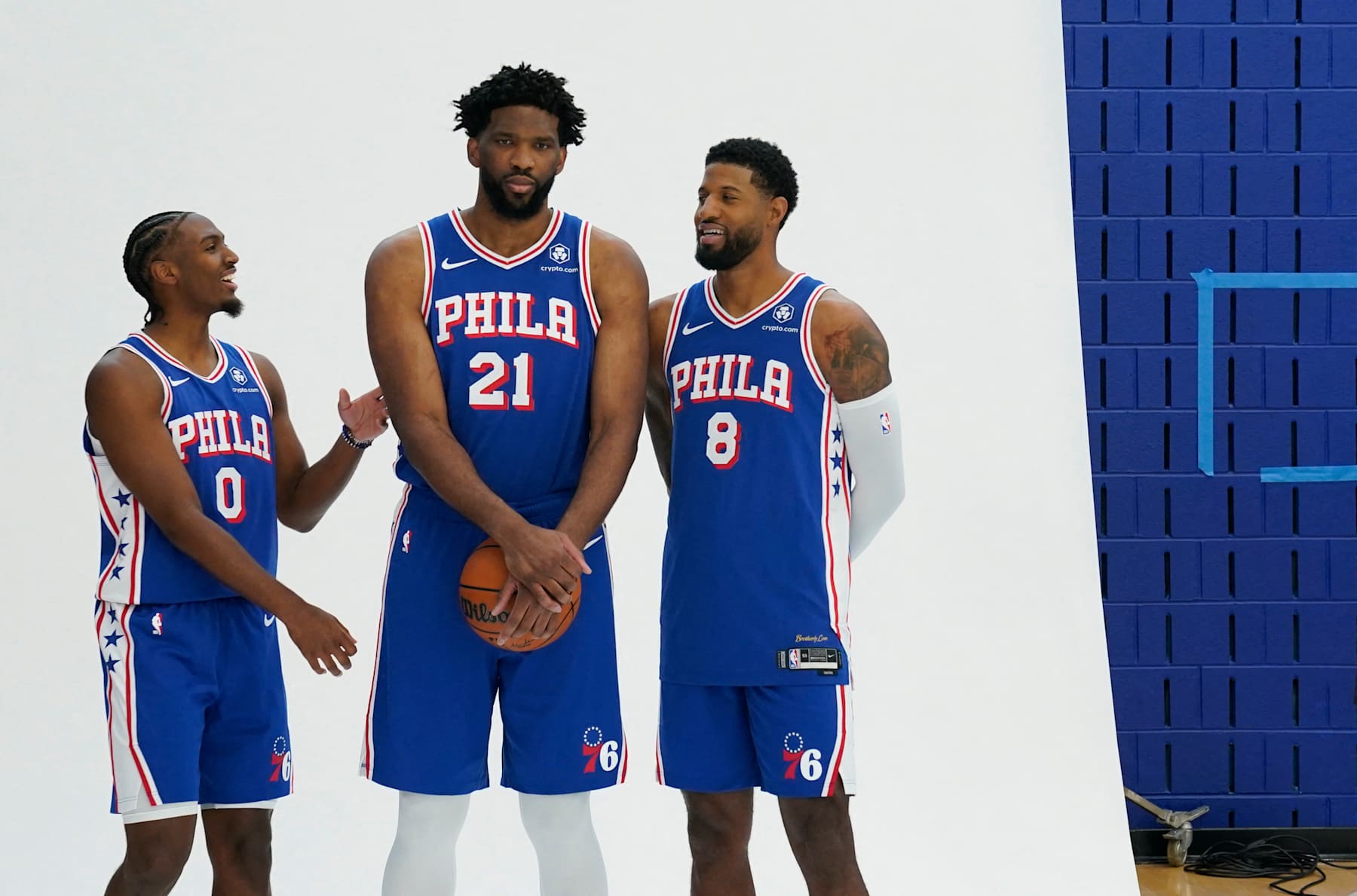 (L-R) Philadelphia 76ers guard Tyrese Maxey, center Joel Embiid and small forward Paul George pose for photos during the 76ers media day ahead of the NBA season at the 76ers Training Complex in Camden, New Jersey, September 30, 2024. (Photo by TIMOTHY A. CLARY / AFP) (Photo by TIMOTHY A. CLARY/AFP via Getty Images)