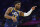 Utah Jazz's Donovan Mitchell reacts during the first half of an NBA basketball game against the Philadelphia 76ers, Thursday, Dec. 9, 2021, in Philadelphia. The Jazz won 118-96. (AP Photo/Chris Szagola)