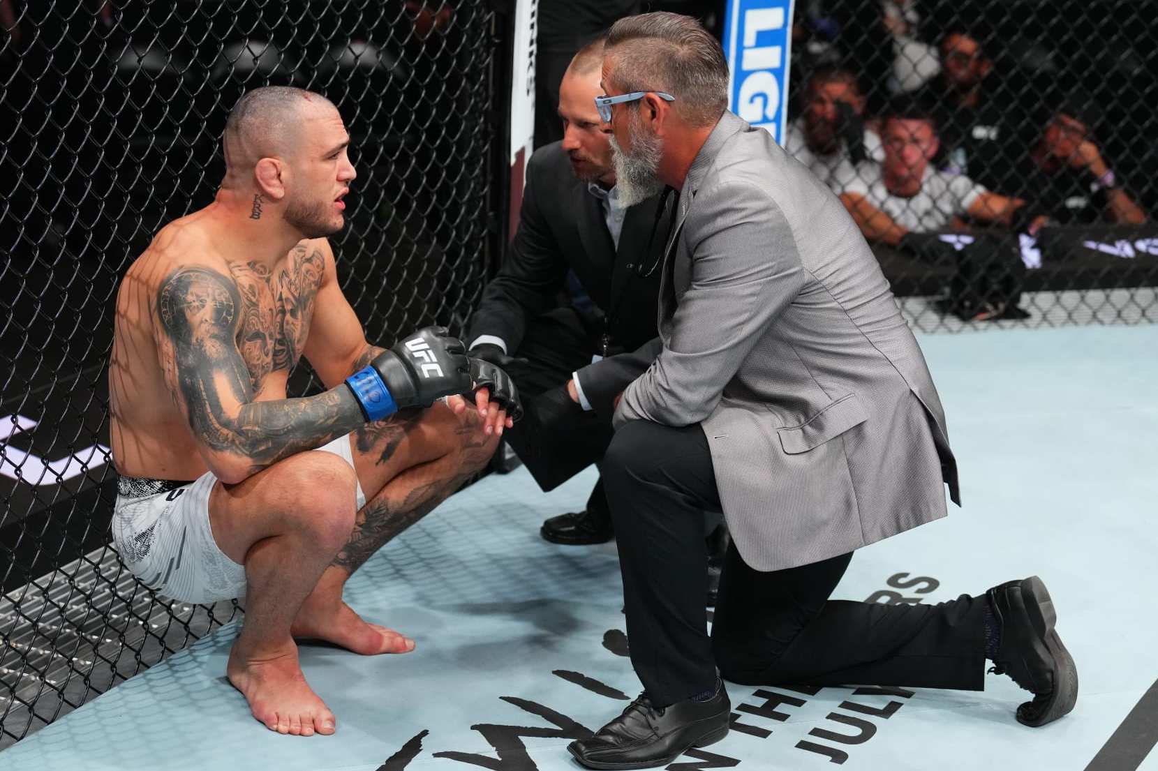 DENVER, COLORADO - JULY 13: Cody Brundage is checked by doctors after his middleweight fight against Abdul Razak Alhassan of Ghana is ruled a no contest due to accidental strikes to the back of the head during the UFC Fight Night event at Ball Arena on July 13, 2024 in Denver, Colorado. (Photo by Josh Hedges/Zuffa LLC via Getty Images)