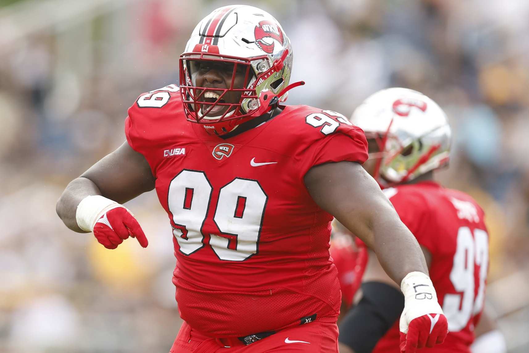 BOCA RATON, FLORIDA - DECEMBER 18: Brodric Martin #99 of the Western Kentucky Hilltoppers celebrates a sack against the Appalachian State Mountaineers during the second half of the RoofClaim.com Boca Raton Bowl at FAU Stadium on December 18, 2021 in Boca Raton, Florida. (Photo by Michael Reaves/Getty Images)