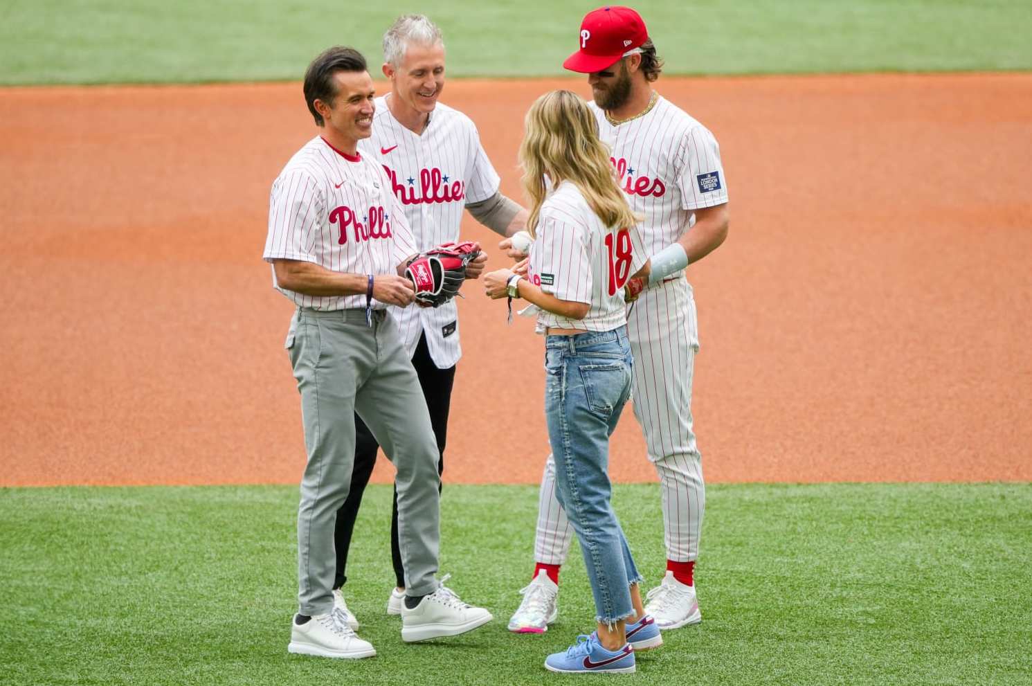 LONDON, ENGLAND - JUNE 09: Rob McElhenney co-owner of Wrexham FC and his wife, Kaitlin Olson, Chase Utley and Bryce Harper #3 of the Philadelphia Phillies throw the ceremonial double play during the 2024 London Series game between the New York Mets and the Philadelphia Phillies at London Stadium on Sunday, June 9, 2024 in London, England. (Photo by Alex Bierens de Haan/MLB Photos via Getty Images)