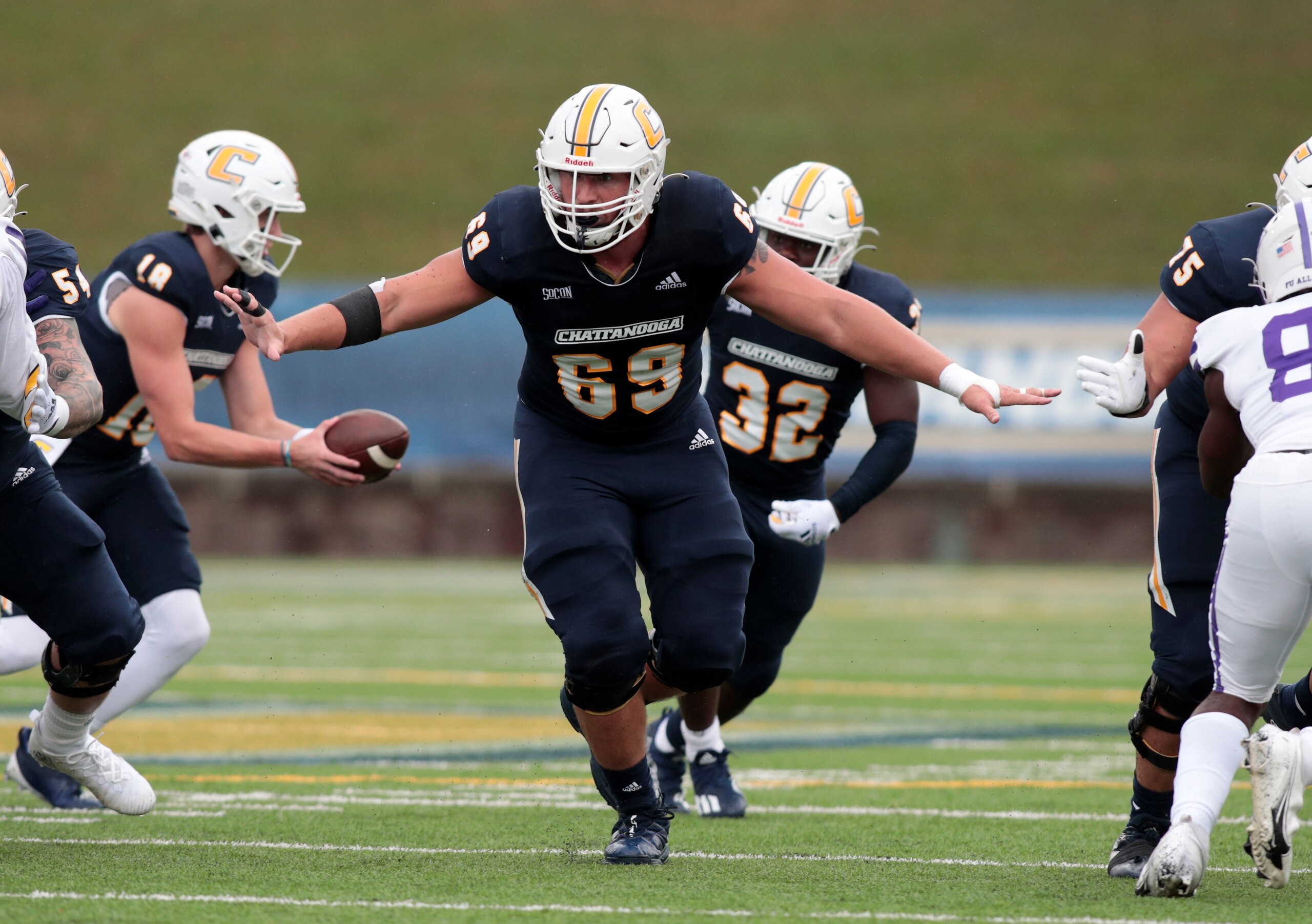 CHATTANOOGA, TN - OCTOBER 30: Chattanooga Mocs offensive lineman Cole Strange (69) blocking during the game between the Chattanooga Mocs and the Furman Paladins on October 30, 2021 at Finley stadium in Chattanooga, Tennessee. (Photo by Charles Mitchell/Icon Sportswire via Getty Images) CHATTANOOGA, TN - OCTOBER 30: Chattanooga Mocs offensive lineman Cole Strange (69) blocking during the game between the Chattanooga Mocs and the Furman Paladins on October 30, 2021 at Finley stadium in Chattanooga, Tennessee. (Photo by Charles Mitchell/Icon Sportswire via Getty Images)