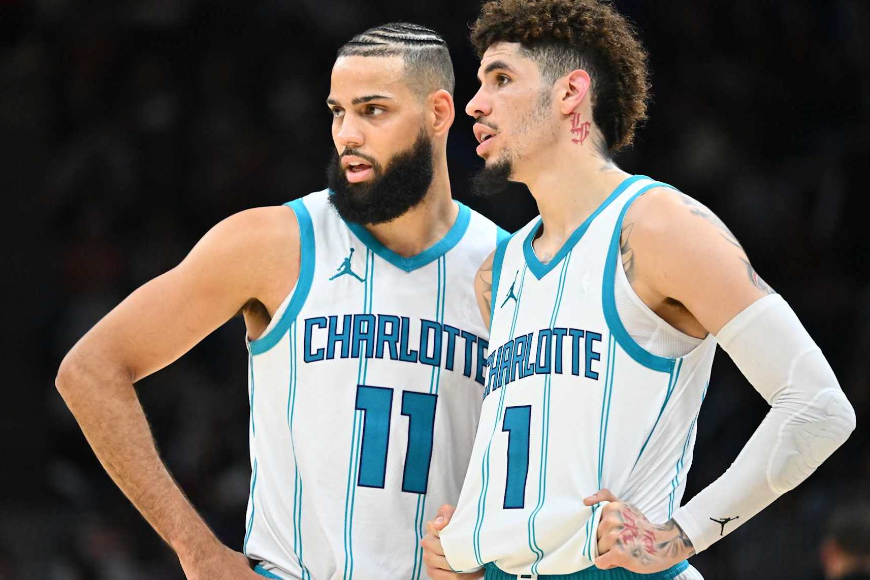 CLEVELAND, OHIO - NOVEMBER 17: Cody Martin #11 talks with LaMelo Ball #1 of the Charlotte Hornets during the second half against the Cleveland Cavaliers at Rocket Mortgage Fieldhouse on November 17, 2024 in Cleveland, Ohio. The Cavaliers defeated the Hornets 128-114. NOTE TO USER: User expressly acknowledges and agrees that, by downloading and or using this photograph, User is consenting to the terms and conditions of the Getty Images License Agreement. (Photo by Jason Miller/Getty Images)