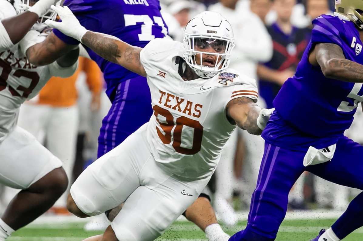 NEW ORLEANS, LA - JANUARY 01: Washington quarterback Michael Penix Jr. (9) attempts to avoid the tackle of Texas defensive lineman Byron Murphy II (90) during the Allstate Sugar Bowl playoff game between the Texas Longhorns and the Washington Huskies on Monday, January 1, 2024 at Caesars Superdome in New Orleans, LA. (Photo by Nick Tre. Smith/Icon Sportswire via Getty Images)