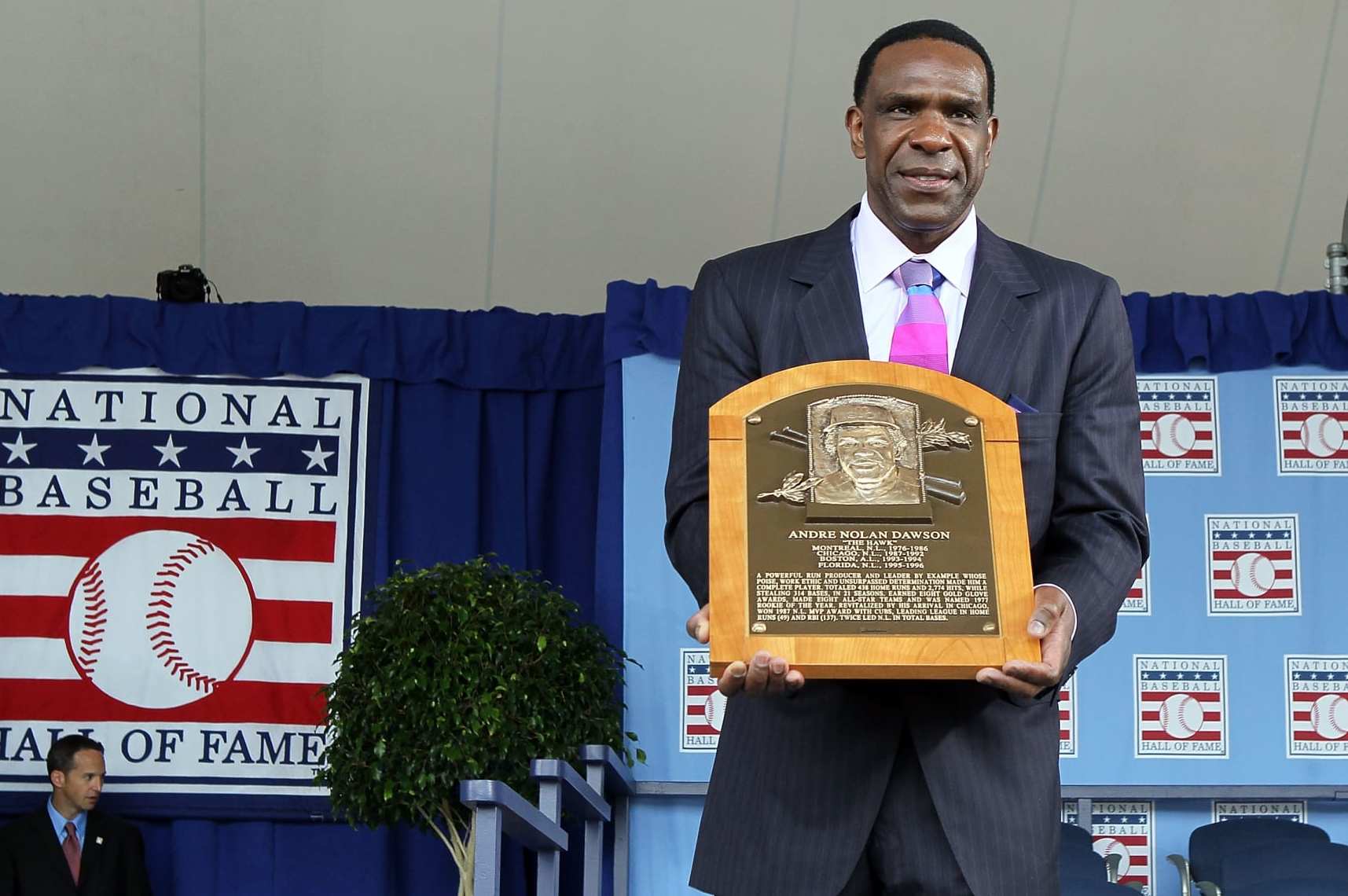 COOPERSTOWN, NY - JULY 25:  2010 inductee Andre Dawson poses for a photograph with his plaque at Clark Sports Center during the Baseball Hall of Fame induction ceremony on July 25, 20010 in Cooperstown, New York. Dawson was an eight time all-star during his twenty one year career finishing with 438 home runs, 1,591 runs batted in, and 314 stolen bases.Dawson was also the National League Rookie of the Year in 1977 with Montreal as well as the National League MVP in 1987 with Chicago.  (Photo by Jim McIsaac/Getty Images)