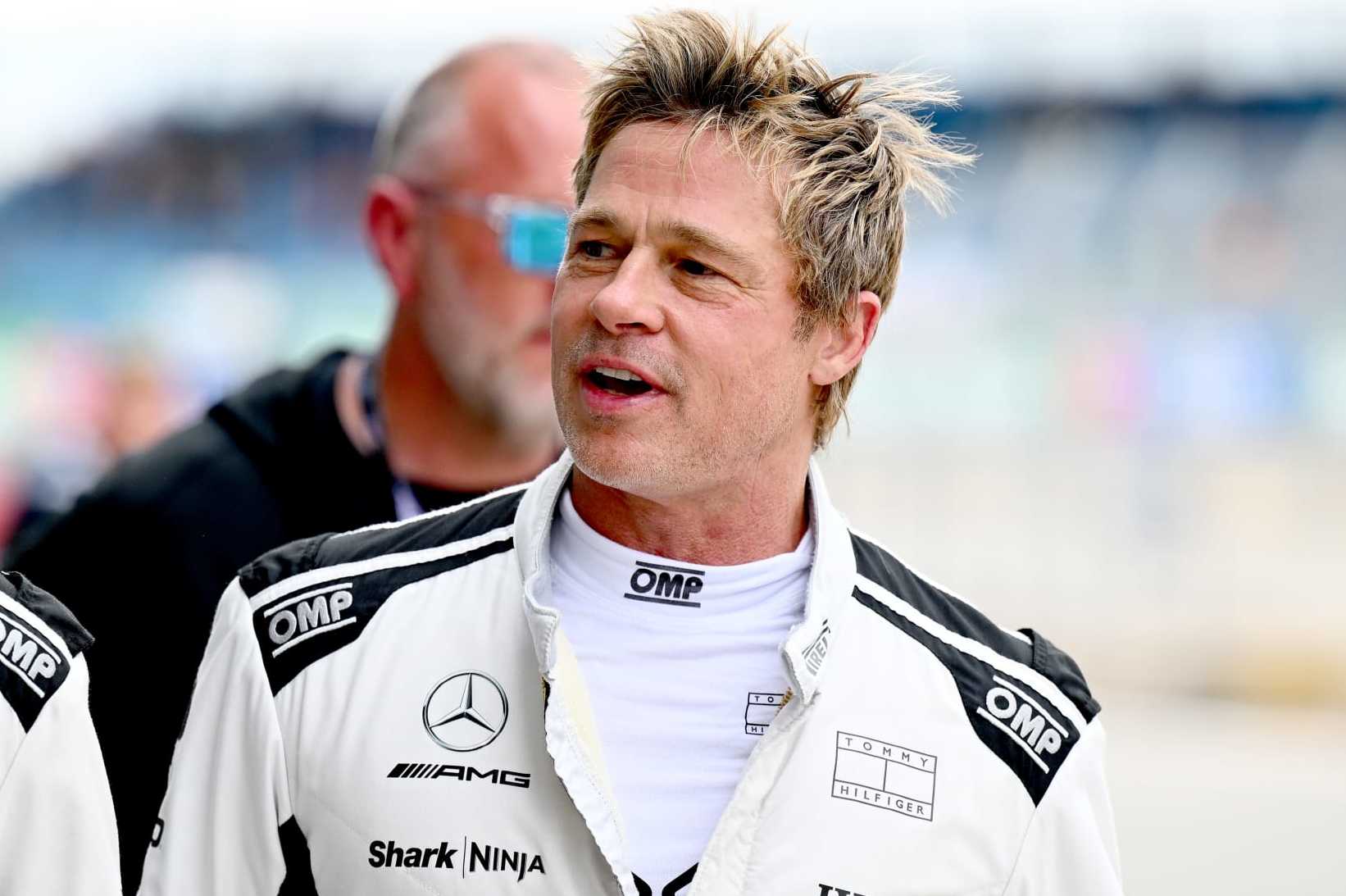 NORTHAMPTON, ENGLAND - JULY 05: Brad Pitt, star of the upcoming Formula One based movie, walks in the Pitlane during practice ahead of the F1 Grand Prix of Great Britain at Silverstone Circuit on July 05, 2024 in Northampton, England. (Photo by James Sutton - Formula 1/Formula 1 via Getty Images)