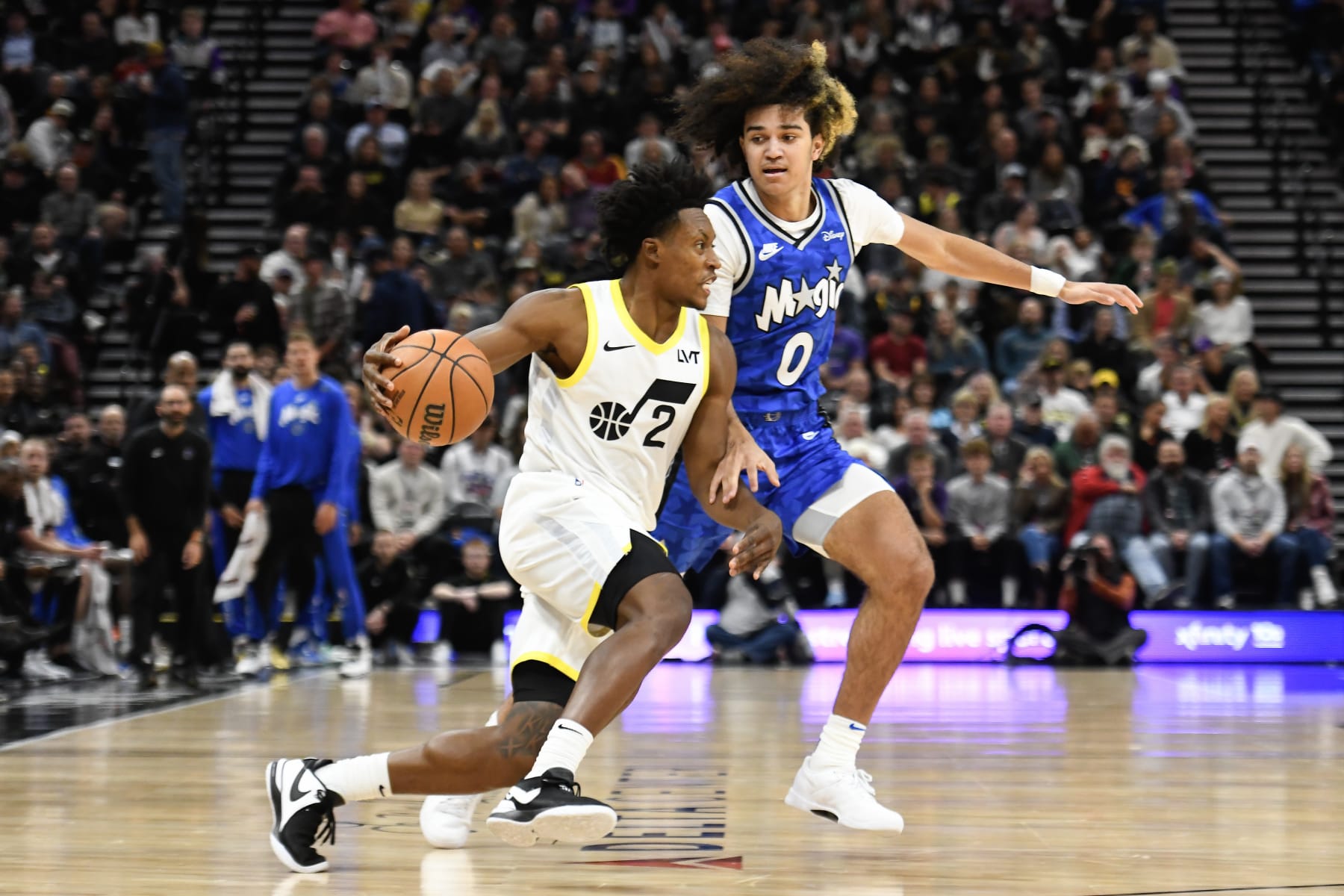 SALT LAKE CITY, UTAH - NOVEMBER 02: Collin Sexton #2 of the Utah Jazz drives into Anthony Black #0 of the Orlando Magic during a game at Delta Center on November 02, 2023 in Salt Lake City, Utah. NOTE TO USER: User expressly acknowledges and agrees that, by downloading and or using this photograph, User is consenting to the terms and conditions of the Getty Images License Agreement.  (Photo by Alex Goodlett/Getty Images)
