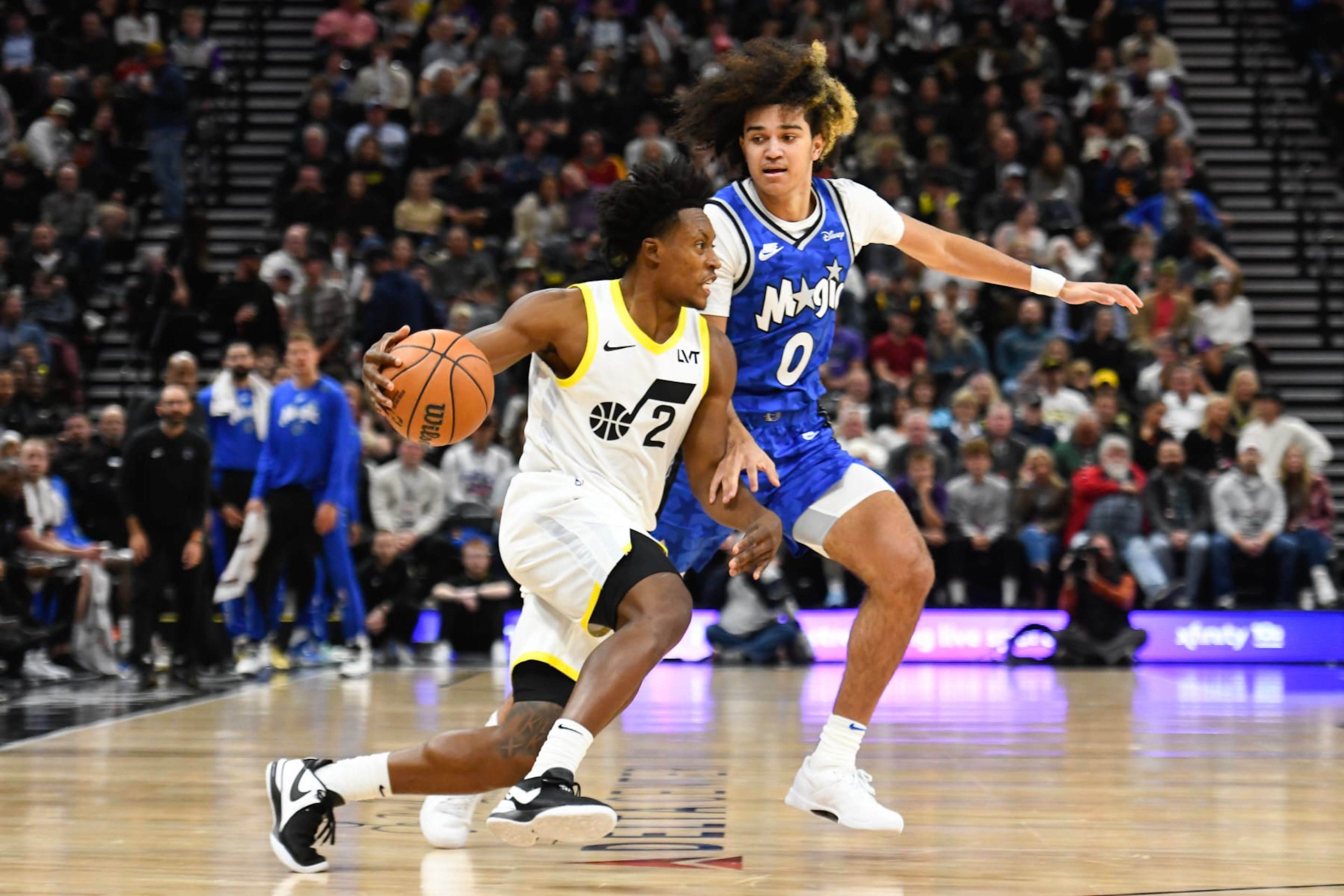 SALT LAKE CITY, UTAH - NOVEMBER 02: Collin Sexton #2 of the Utah Jazz drives into Anthony Black #0 of the Orlando Magic during a game at Delta Center on November 02, 2023 in Salt Lake City, Utah. NOTE TO USER: User expressly acknowledges and agrees that, by downloading and or using this photograph, User is consenting to the terms and conditions of the Getty Images License Agreement.  (Photo by Alex Goodlett/Getty Images)