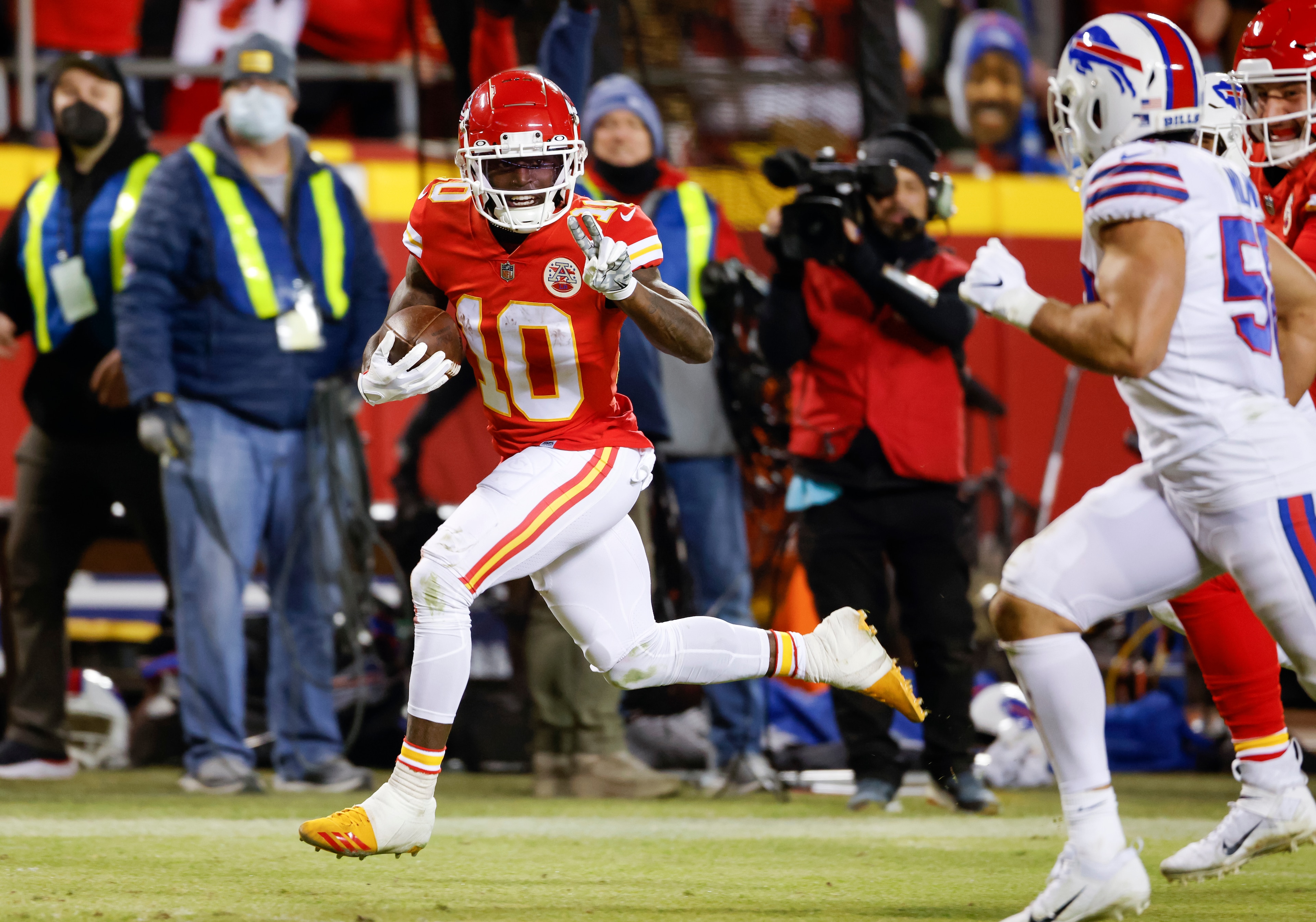Kansas City Chiefs wide receiver Tyreek Hill (10) heads toward the end zone to score on a 64-yard pass during the second half of an NFL divisional round playoff football game against the Buffalo Bills, Sunday, Jan. 23, 2022, in Kansas City, Mo. (AP Photo/Colin E. Braley) Kansas City Chiefs wide receiver Tyreek Hill (10) heads toward the end zone to score on a 64-yard pass during the second half of an NFL divisional round playoff football game against the Buffalo Bills, Sunday, Jan. 23, 2022, in Kansas City, Mo. (AP Photo/Colin E. Braley)