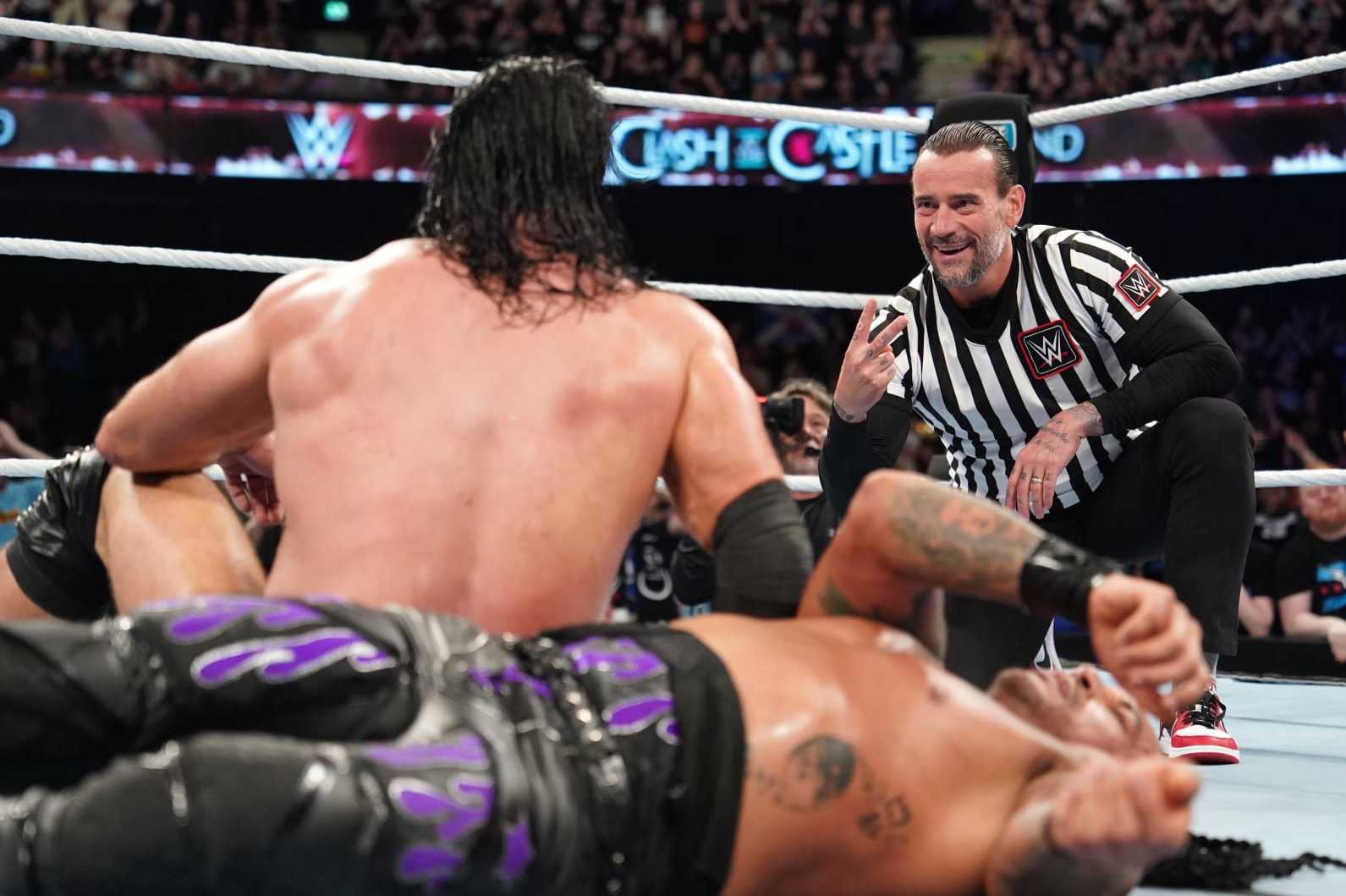 GLASGOW, SCOTLAND - JUNE 15: CM Punk taunts Drew McIntyre after Punk interfered with McIntyre's match against Damian Priest (not pictured) during WWE's Clash at the Castle, Premium Live Event at The OVO Hydro on June 15, 2024 in Glasgow, Scotland.  (Photo by WWE/Getty Images)