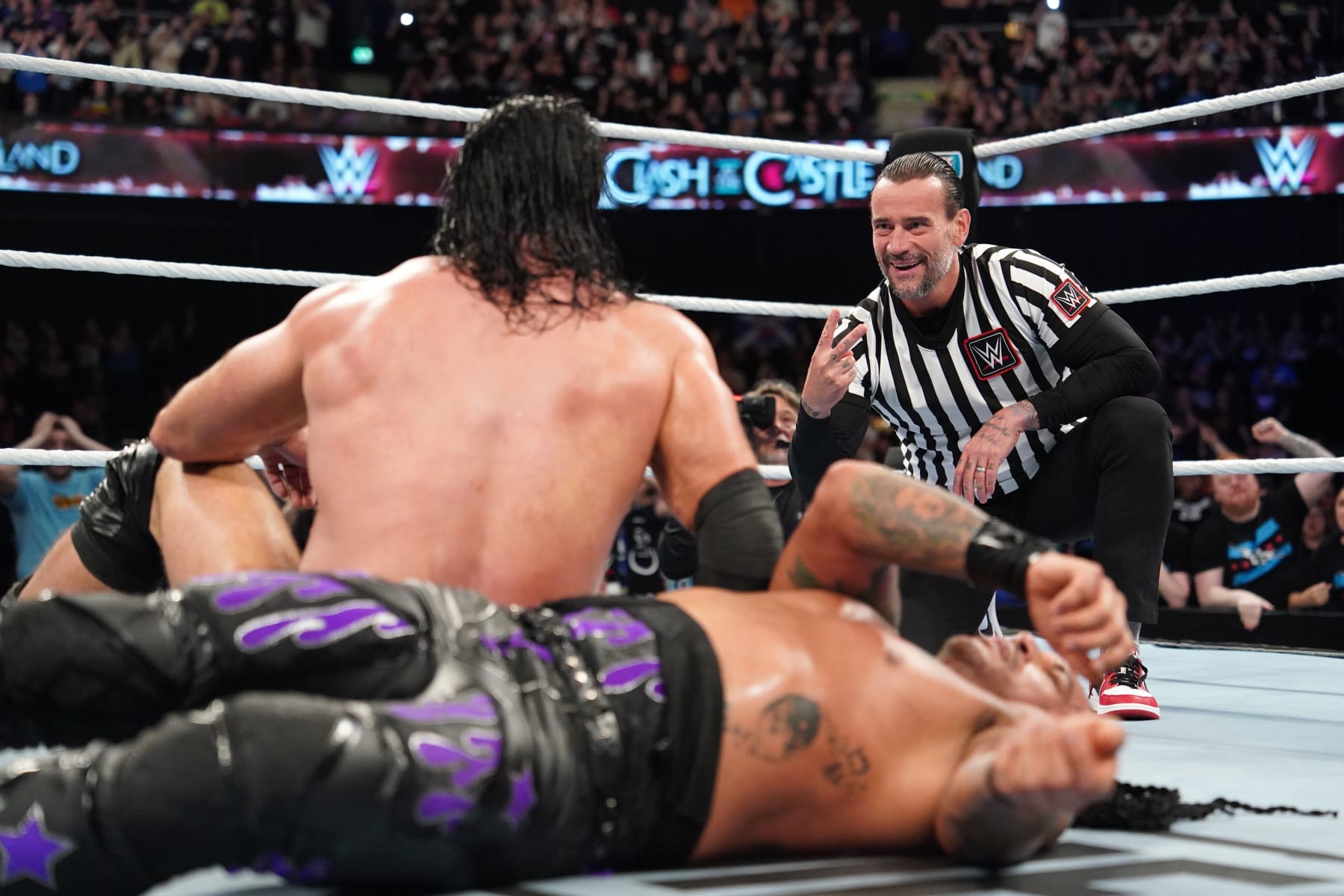 GLASGOW, SCOTLAND - JUNE 15: CM Punk taunts Drew McIntyre after Punk interfered with McIntyre's match against Damian Priest (not pictured) during WWE's Clash at the Castle, Premium Live Event at The OVO Hydro on June 15, 2024 in Glasgow, Scotland.  (Photo by WWE/Getty Images)