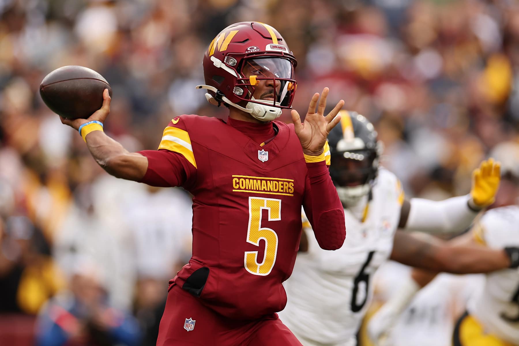 LANDOVER, MARYLAND - NOVEMBER 10: Jayden Daniels #5 of the Washington Commanders looks to pass in the second quarter of a game against the Pittsburgh Steelers at Northwest Stadium on November 10, 2024 in Landover, Maryland. (Photo by Scott Taetsch/Getty Images)