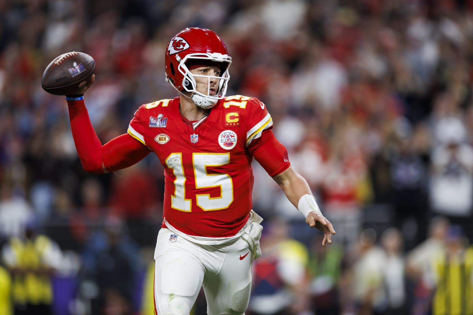 LAS VEGAS, NEVADA - FEBRUARY 11: Patrick Mahomes #15 of the Kansas City Chiefs rolls out and looks to throw a pass to Mecole Hardman Jr. to score the game-winning touchdown during Super Bowl LVIII against the San Francisco 49ers at Allegiant Stadium on February 11, 2024 in Las Vegas, Nevada. (Photo by Ryan Kang/Getty Images)