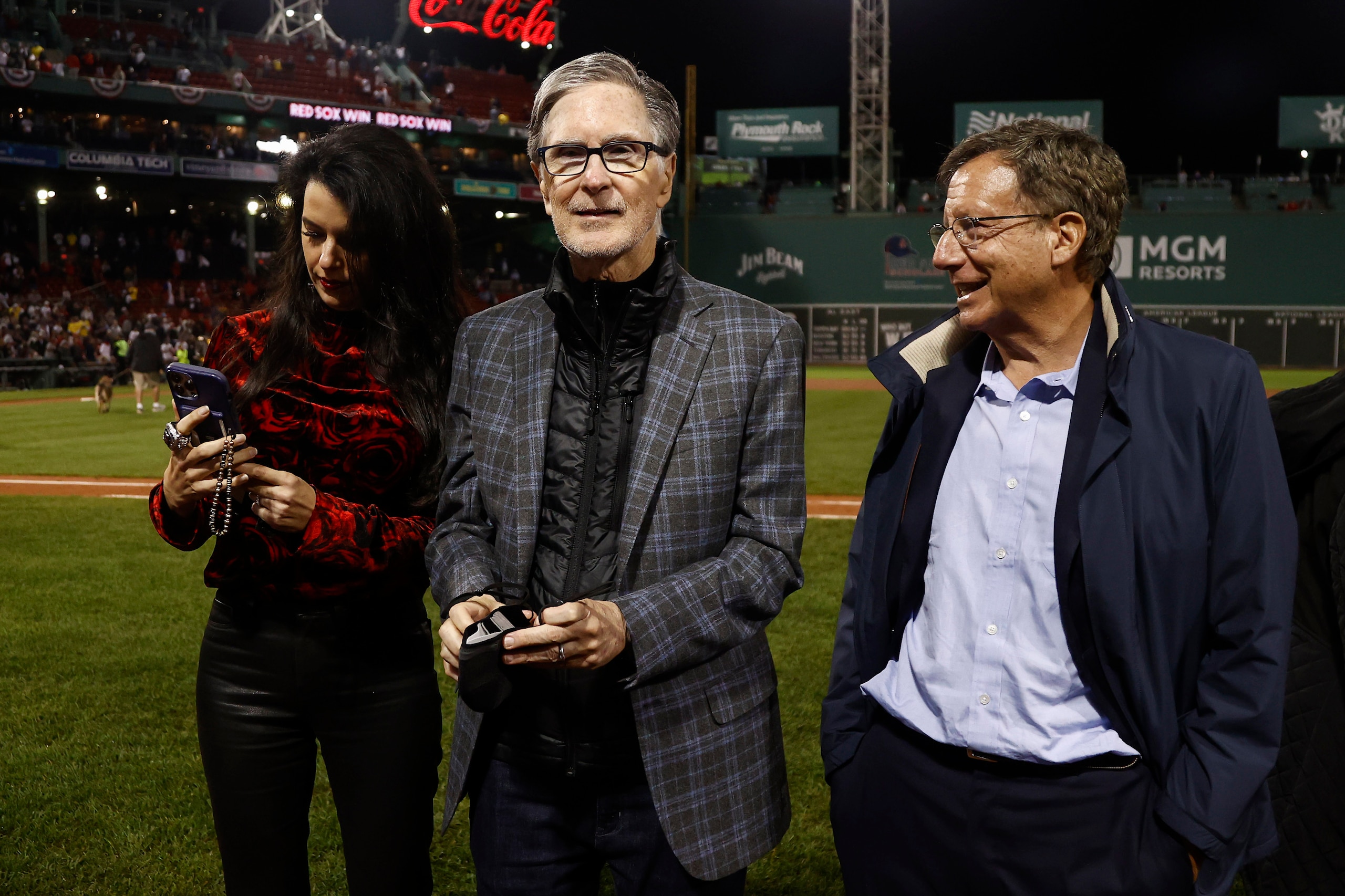BOSTON, MA - OCTOBER 5: Boston Red Sox Principal Owner John Henry, his wife Linda Pizzuti Henry and Chairman Tom Werner after the AL Wild Card playoff game against the New York Yankees at Fenway Park on October 6, 2021 in Boston, Massachusetts. (Photo By Winslow Townson/Getty Images)