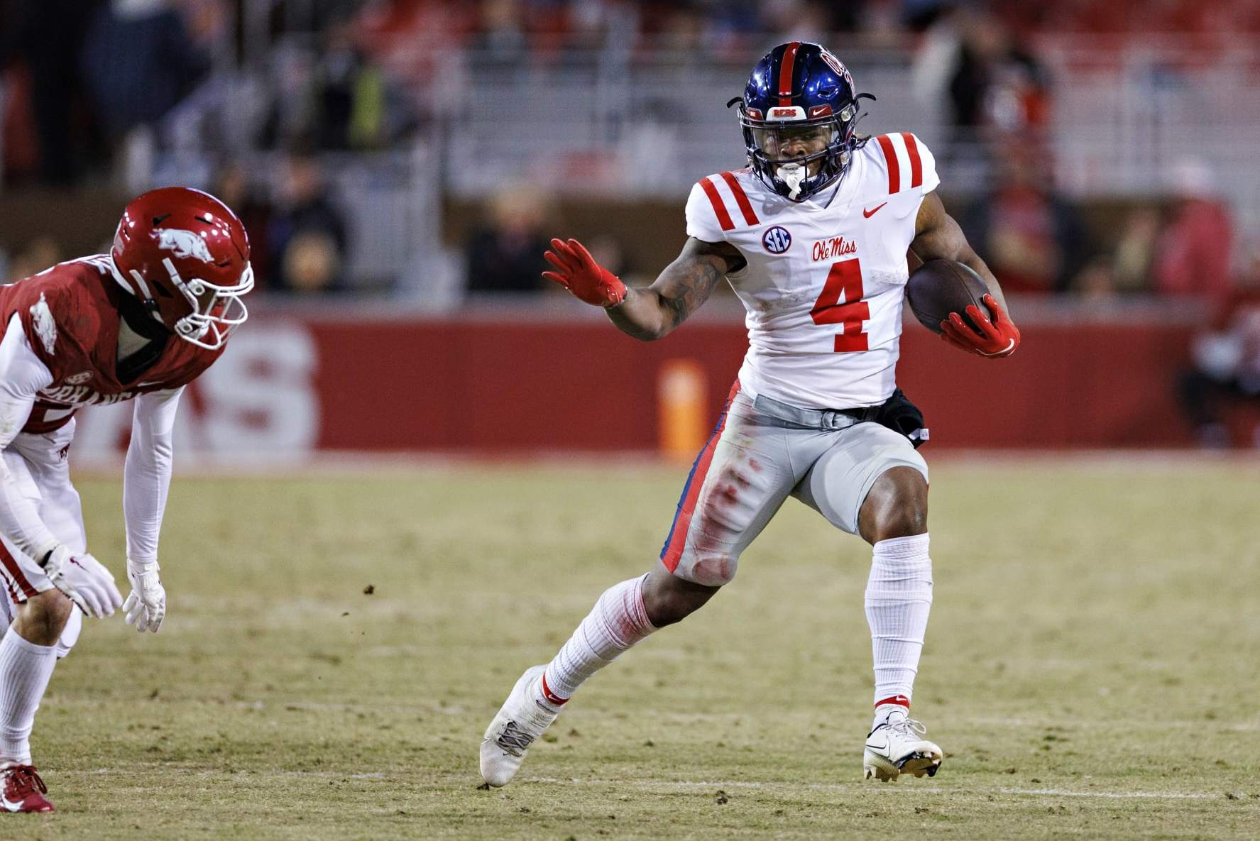 FAYETTEVILLE, ARKANSAS - NOVEMBER 19: Quinshon Judkins #4 of the Mississippi Rebels runs the ball during a game against the Arkansas Razorbacks at Donald W. Reynolds Razorback Stadium on November 19, 2022 in Fayetteville, Arkansas. The Razorbacks defeated the Rebels 42-27. (Photo by Wesley Hitt/Getty Images)