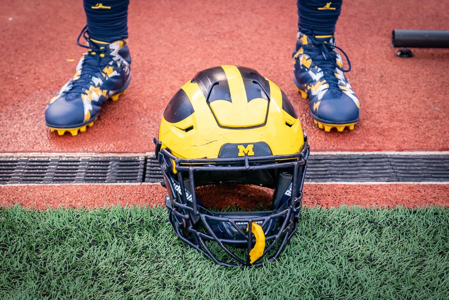 ANN ARBOR, MI - APRIL 01: A Michigan Football helmet rests on the ground following the spring football game at Michigan Stadium on April 1, 2023 in Ann Arbor, Michigan. (Photo by Jaime Crawford/Getty Images)