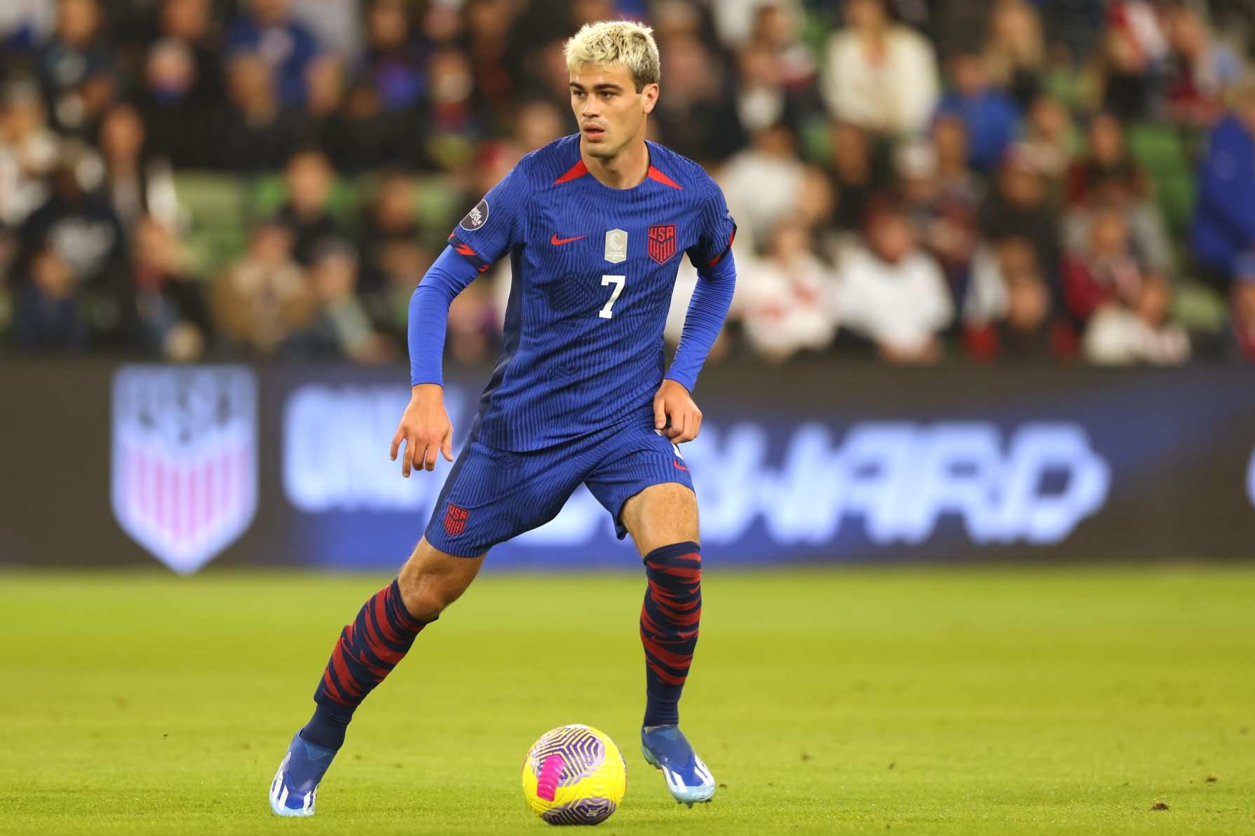 AUSTIN, TEXAS - NOVEMBER 16: Gio Reyna #7 of the United States on the ball during the first half of a Concacaf Nations League Quarterfinal Round leg 1 match against Trinidad and Tobago at Q2 Stadium on November 16, 2023 in Austin, Texas. (Photo by John Dorton/ISI Photos/USSF/Getty Images for USSF)