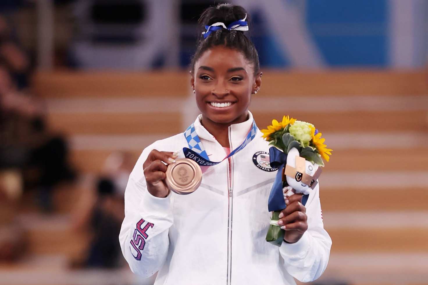 TOKYO, JAPAN - AUGUST 03: Simone Biles of Team United States poses with the bronze medal during the Women's Balance Beam Final medal ceremony on day eleven of the Tokyo 2020 Olympic Games at Ariake Gymnastics Centre on August 03, 2021 in Tokyo, Japan. (Photo by Jamie Squire/Getty Images)