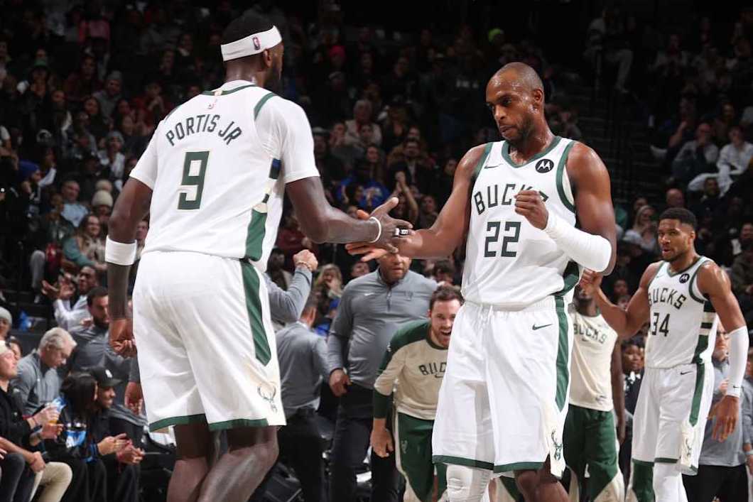 BROOKLYN, NY - DECEMBER 8: Khris Middleton #22 and Bobby Portis #9 of the Milwaukee Bucks high five during the game against the Brooklyn Nets on December 8, 2024 at Barclays Center in Brooklyn, New York. NOTE TO USER: User expressly acknowledges and agrees that, by downloading and or using this Photograph, user is consenting to the terms and conditions of the Getty Images License Agreement. Mandatory Copyright Notice: Copyright 2024 NBAE (Photo by Nathaniel S. Butler/NBAE via Getty Images)