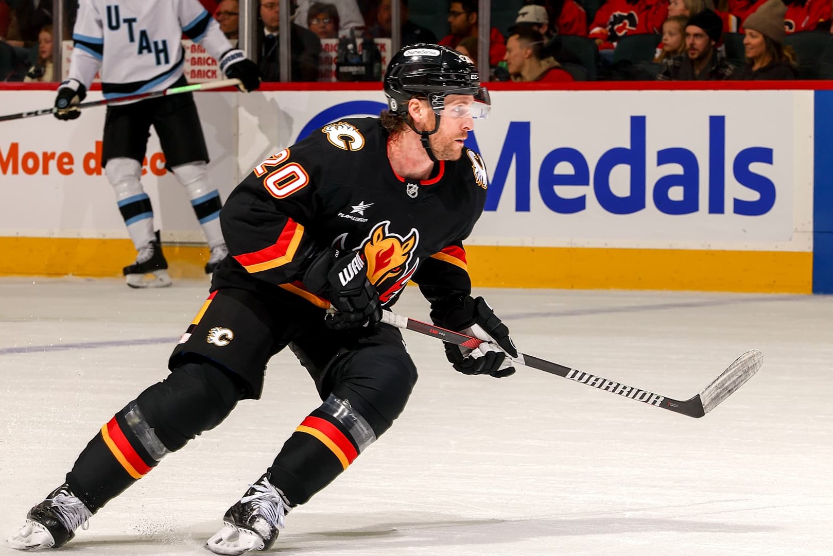 CALGARY, AB - JANUARY 2: Blake Coleman #20 of the Calgary Flames skates up ice against the Utah Hockey Club at Scotiabank Saddledome on January 2, 2025 in Calgary, Alberta, Canada. (Photo by Gerry Thomas/NHLI via Getty Images)