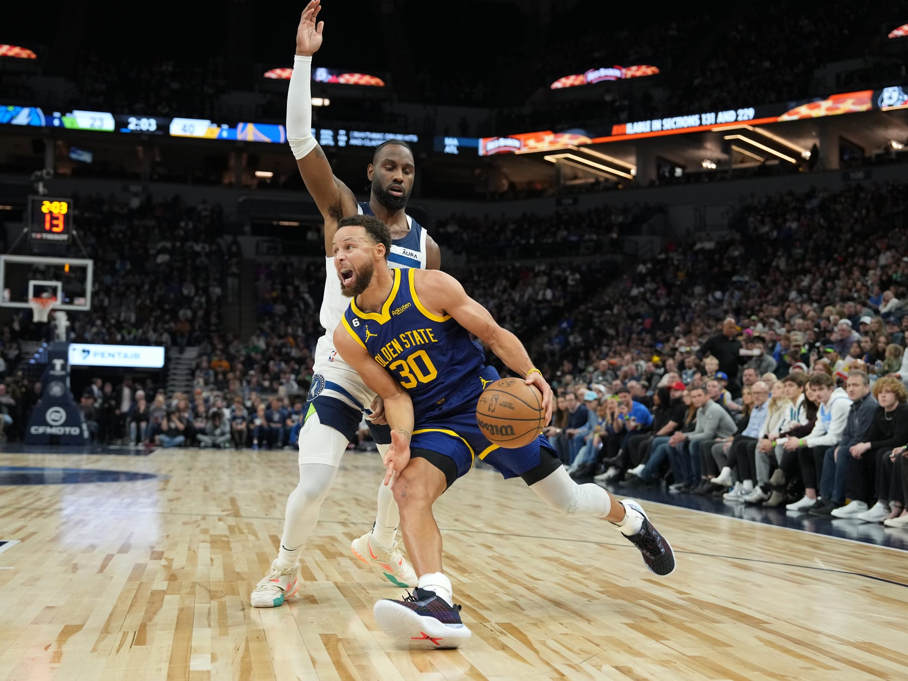 MINNEAPOLIS, MN - NOVEMBER 27: Stephen Curry #30 of the Golden State Warriors drives to the basket against the Minnesota Timberwolves on November 27, 2022 at Target Center in Minneapolis, Minnesota. NOTE TO USER: User expressly acknowledges and agrees that, by downloading and or using this Photograph, user is consenting to the terms and conditions of the Getty Images License Agreement. Mandatory Copyright Notice: Copyright 2022 NBAE (Photo by Jordan JohnsonNBAE via Getty Images)