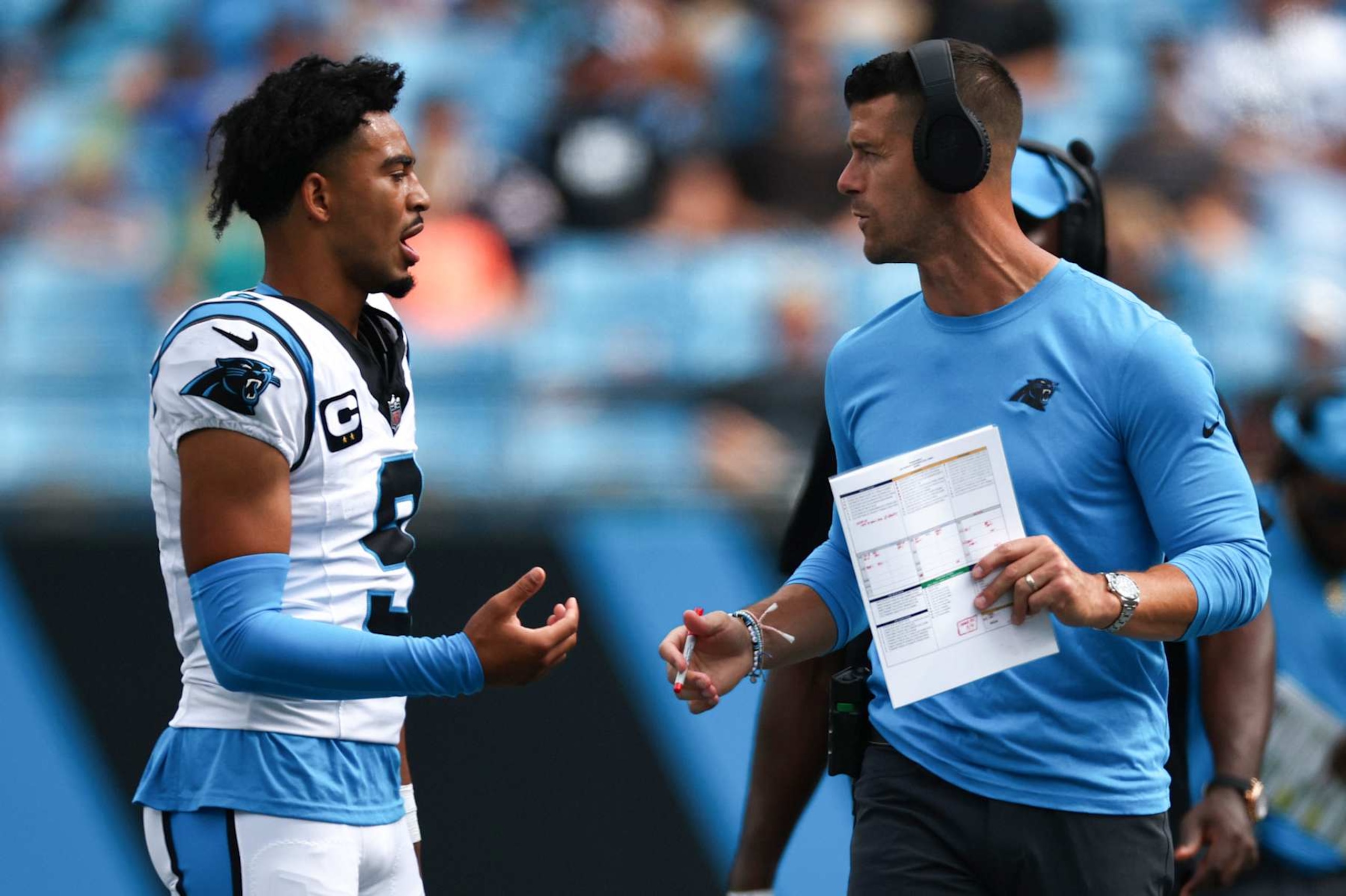 CHARLOTTE, NORTH CAROLINA - SEPTEMBER 15: Quarterback Bryce Young #9 talks with head coach Dave Canales of the Carolina Panthers talks with at Bank of America Stadium on September 15, 2024 in Charlotte, North Carolina. (Photo by Jared C. Tilton/Getty Images) CHARLOTTE, NORTH CAROLINA - SEPTEMBER 15: Quarterback Bryce Young #9 talks with head coach Dave Canales of the Carolina Panthers talks with at Bank of America Stadium on September 15, 2024 in Charlotte, North Carolina. (Photo by Jared C. Tilton/Getty Images)