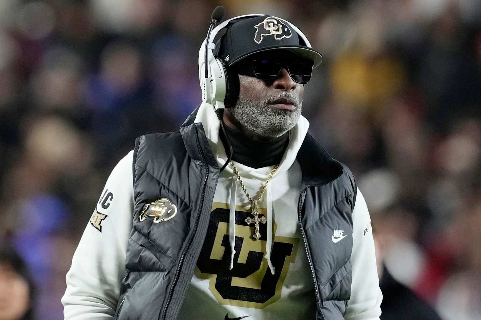KANSAS CITY, MISSOURI - NOVEMBER 23: Head coach Deion Sanders of the Colorado Buffaloes walks the side line in the second half against the Kansas Jayhawks at Arrowhead Stadium on November 23, 2024 in Kansas City, Missouri.  (Photo by Ed Zurga/Getty Images)