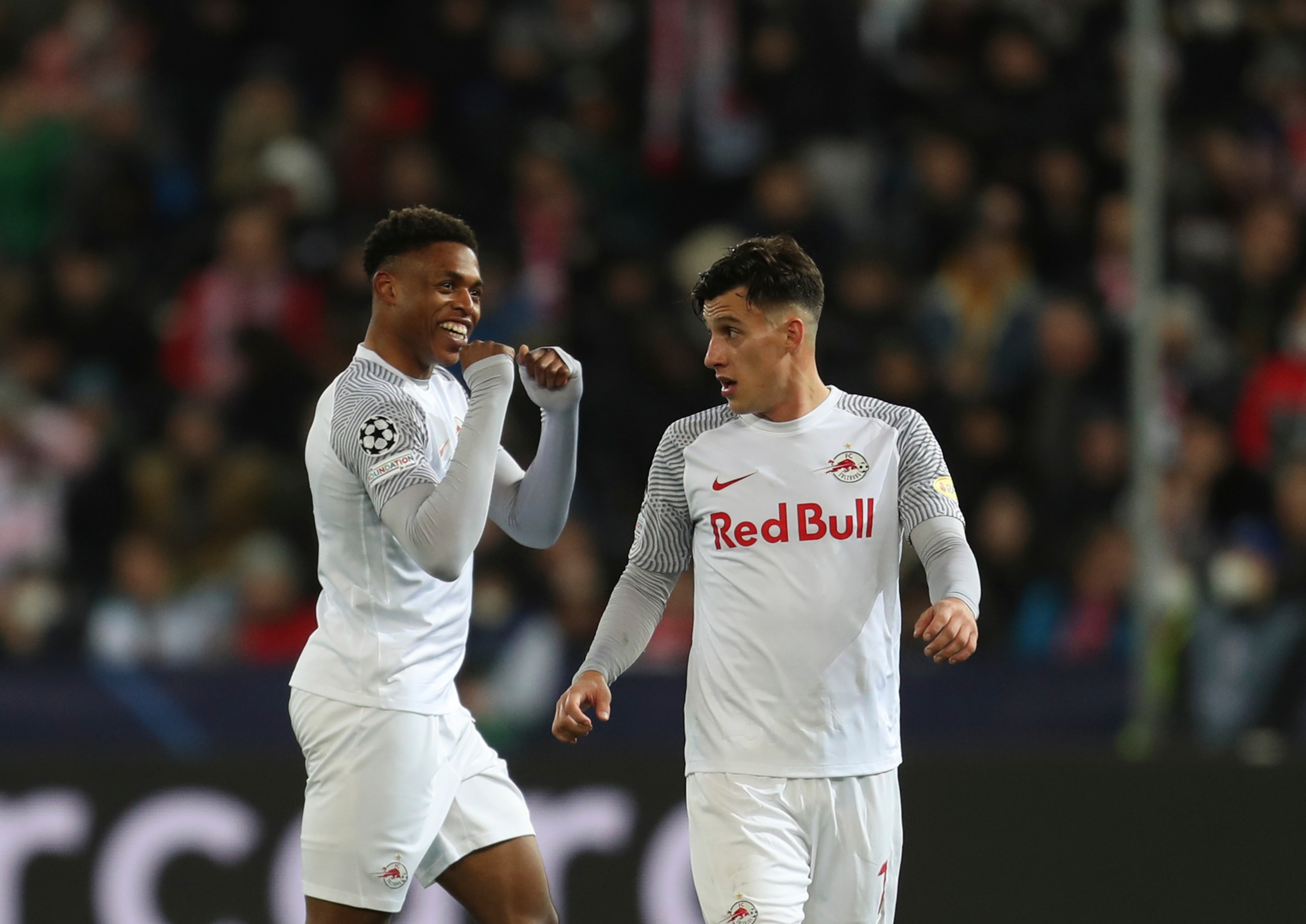 Salzburg's Chukwubuike Adamu, left, celebrates after scoring his side's opening goal during the Champions League, round of 16, first leg soccer match between Salzburg and Bayern, at the Salzburg stadium, in Salzburg, Austria, Wednesday, Feb. 16, 2022. (AP Photo/Alexandra Beier) Salzburg's Chukwubuike Adamu, left, celebrates after scoring his side's opening goal during the Champions League, round of 16, first leg soccer match between Salzburg and Bayern, at the Salzburg stadium, in Salzburg, Austria, Wednesday, Feb. 16, 2022. (AP Photo/Alexandra Beier)