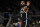 Brooklyn Nets' Kyrie Irving gestures to teammates during the second half of an NBA preseason basketball game against the Milwaukee Bucks Wednesday, Oct. 12, 2022, in Milwaukee. (AP Photo/Aaron Gash)