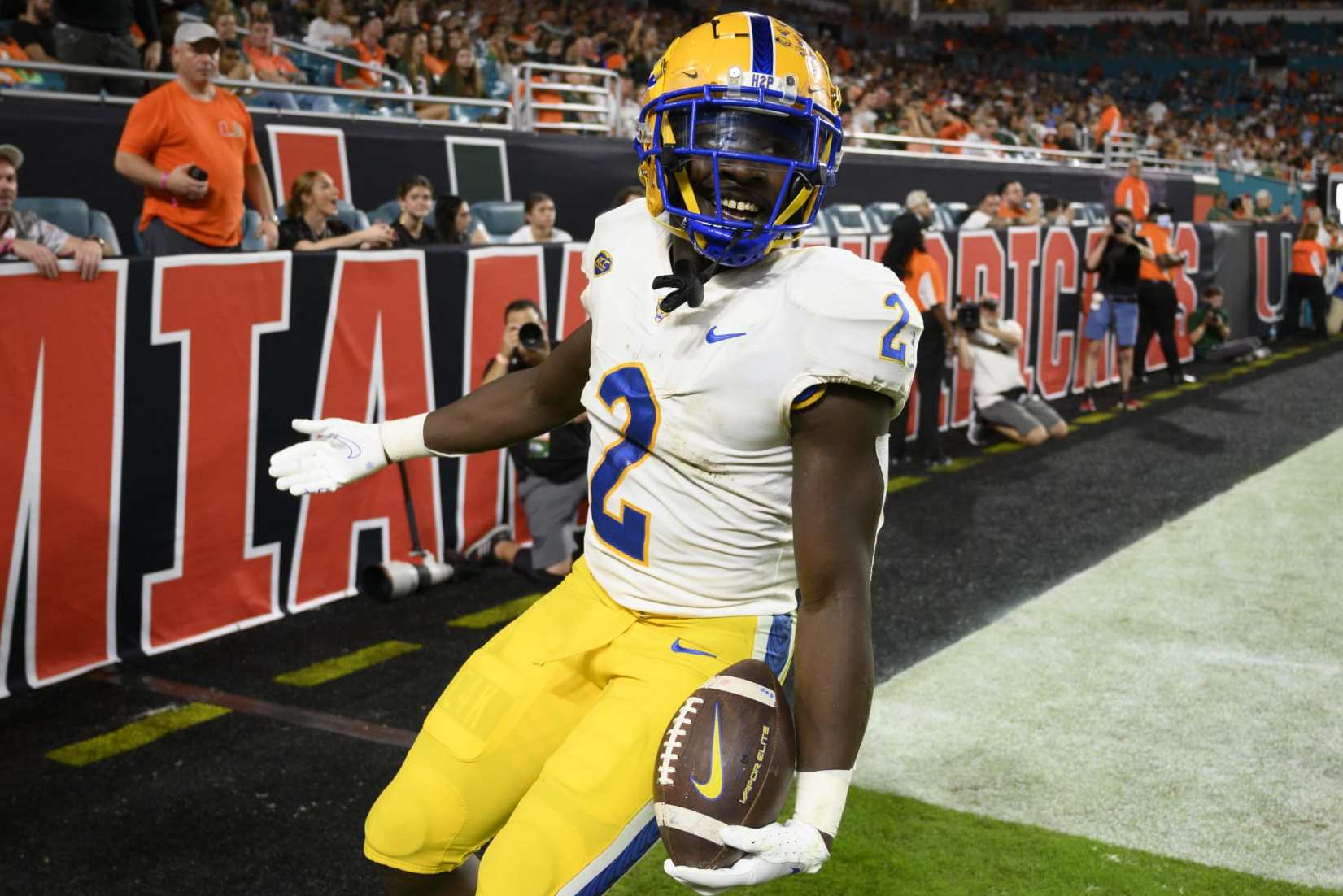 MIAMI GARDENS, FL - NOVEMBER 26: Pittsburgh running back Israel Abanikanda (2) smiles as he celebrates scoring touchdown during an college football game between the Pittsburgh Panthers and the University of Miami Hurricanes on November 26, 2022 at the Hard Rock Stadium in Miami Gardens, FL. (Photo by Doug Murray/Icon Sportswire via Getty Images)