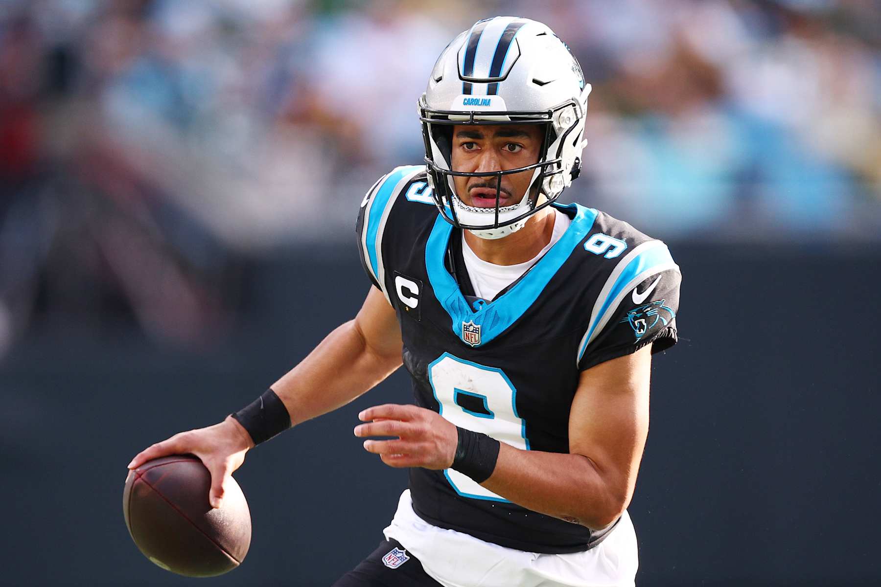 CHARLOTTE, NORTH CAROLINA - DECEMBER 24: Bryce Young #9 of the Carolina Panthers carries the ball during the third quarter /agp at Bank of America Stadium on December 24, 2023 in Charlotte, North Carolina. (Photo by Jared C. Tilton/Getty Images)