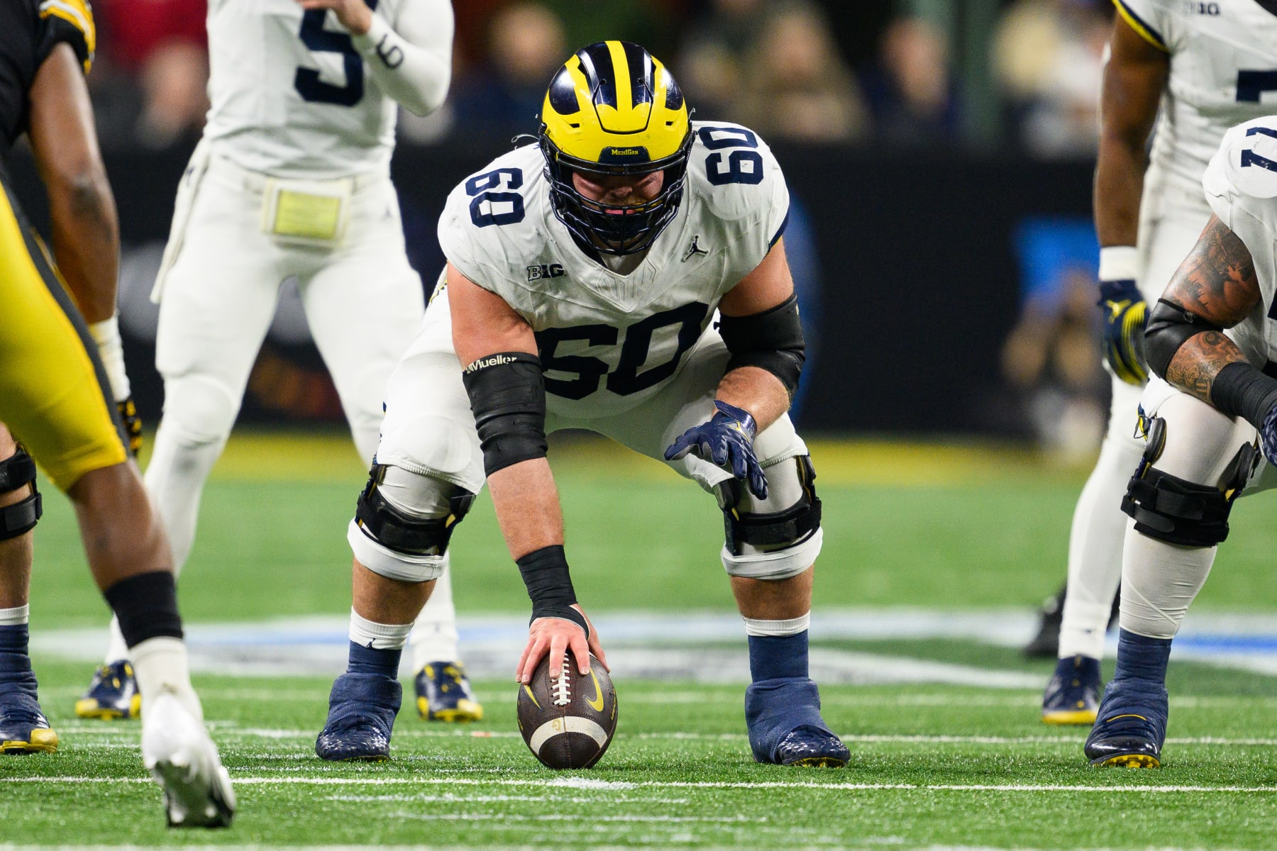 INDIANAPOLIS, IN - DECEMBER 02: Michigan Wolverines offensive lineman Drake Nugent (60) prepares to snap the ball during the Big 10 Championship game between the Michigan Wolverines and Iowa Hawkeyes on December 2, 2023, at Lucas Oil Stadium in Indianapolis, IN. (Photo by Zach Bolinger/Icon Sportswire via Getty Images)