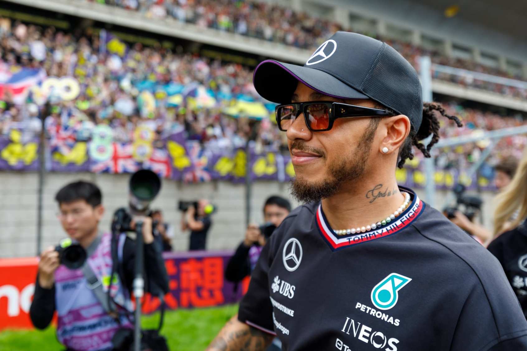 SHANGHAI, CHINA - APRIL 21: British racing driver Lewis Hamilton receives an interview and interacts with supporters during the 2024 F1 Chinese Grand Prix at the Shanghai International Circuit on April 21, 2024 in Shanghai, China. (Photo by VCG/VCG via Getty Images)