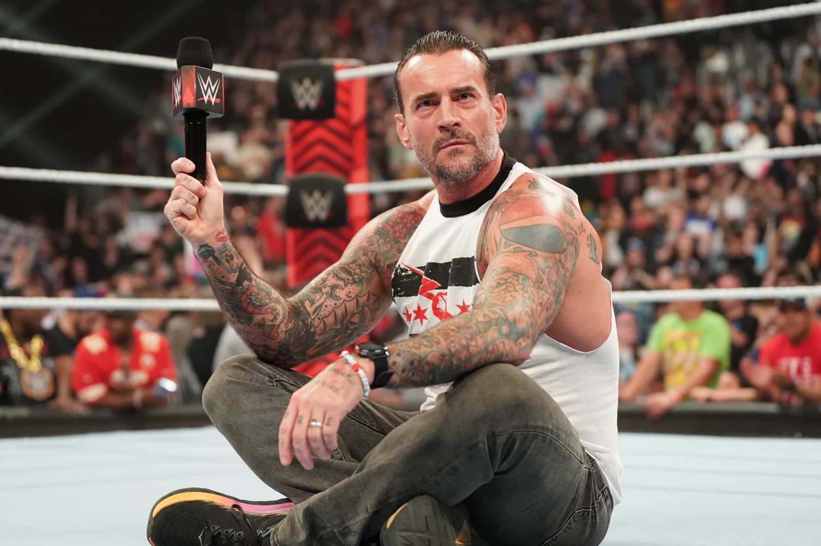 KANSAS CITY, MISSOURI - APRIL 29: CM Punk drops a Pipe Bomb at T-Mobile Center on April 29, 2024 in Kansas City, Missouri.  (Photo by WWE/Getty Images)