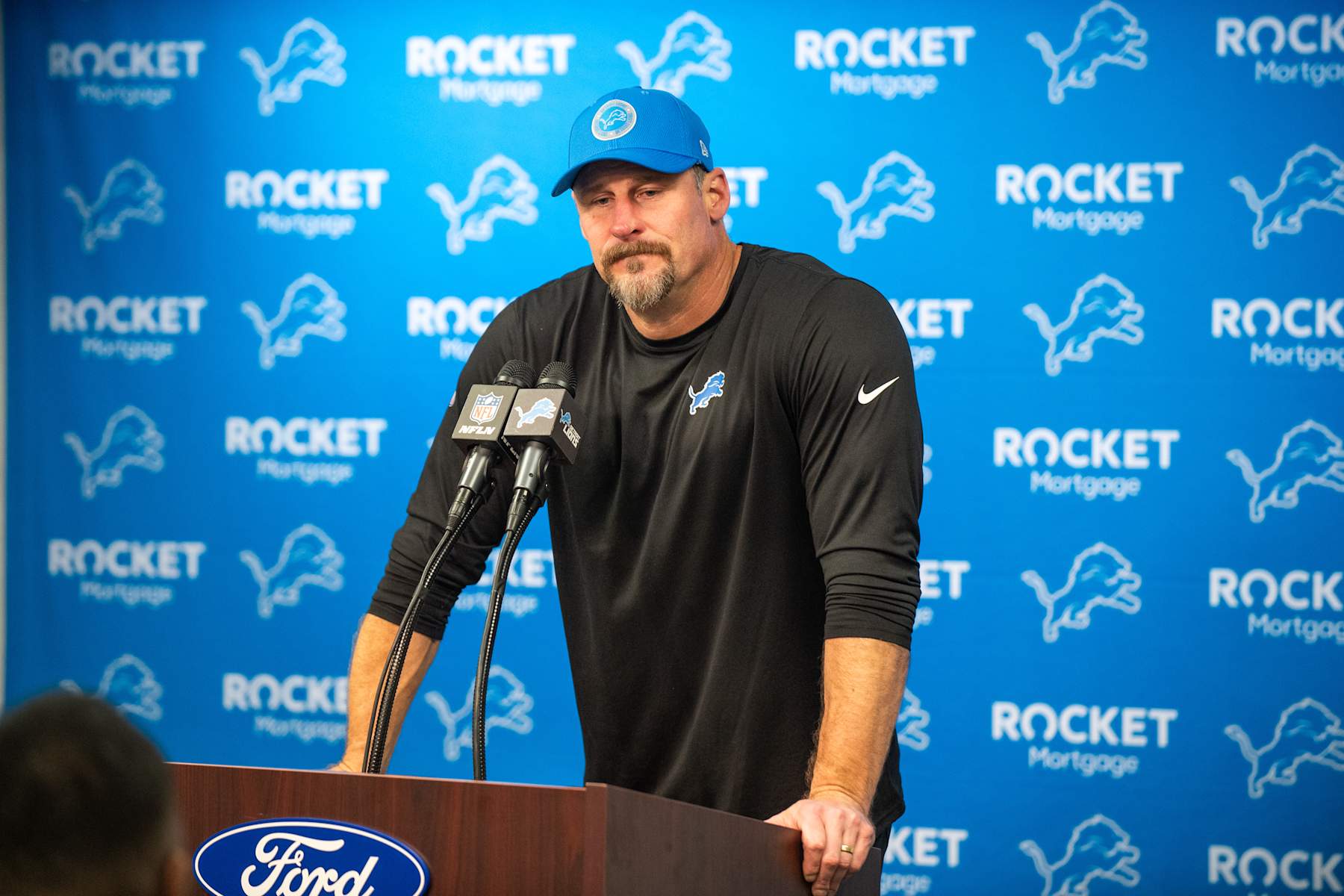 DETROIT, MICHIGAN - DECEMBER 05: Head Football Coach Dan Campbell of the Detroit Lions speaks to media during the post game press conference after an NFL game against the Green Bay Packers at Ford Field on December 05, 2024 in Detroit, Michigan. The Detroit Lions won the game 34-31. (Photo by Aaron J. Thornton/Getty Images)
