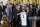 San Antonio Spurs players Tim Duncan, Manu Ginobili, Tony Parker and others pose with US President Barack Obama during an event in the East Room of the White House January 12, 2015 in Washington, DC. Obama and members of the National Basketball Associatio