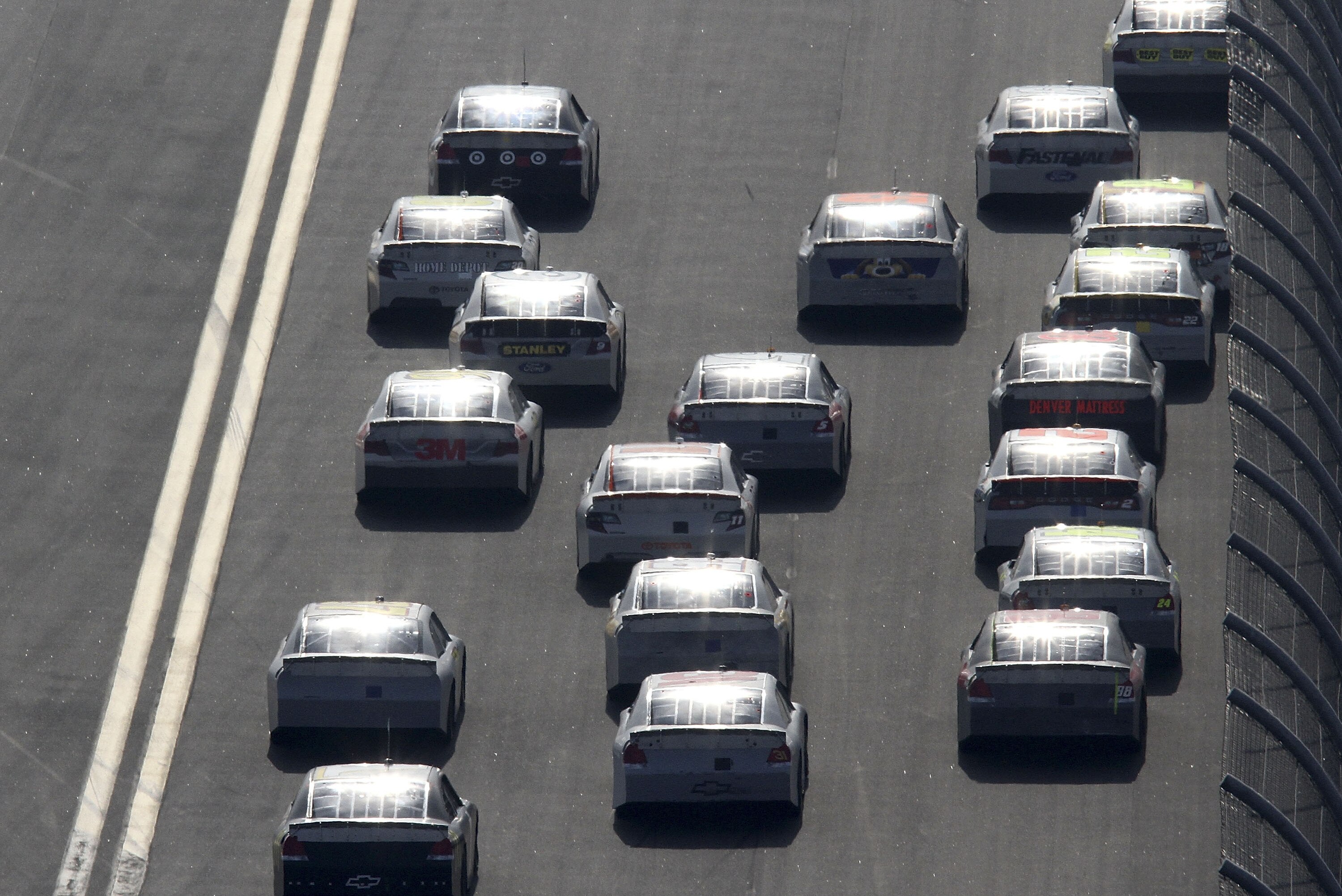 DAYTONA BEACH, FL - JANUARY 14: A group of cars race during Daytona Preseason Thunder at Daytona International Speedway on January 14, 2012 in Daytona Beach, Florida. (Photo by Jerry Markland/Getty Images for NASCAR)