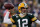 GREEN BAY, WI - JANUARY 15:   Aaron Rodgers #12 of the Green Bay Packers drops back to pass against the New York Giants during their NFC Divisional playoff game at Lambeau Field on January 15, 2012 in Green Bay, Wisconsin.  (Photo by Jonathan Daniel/Getty Images)