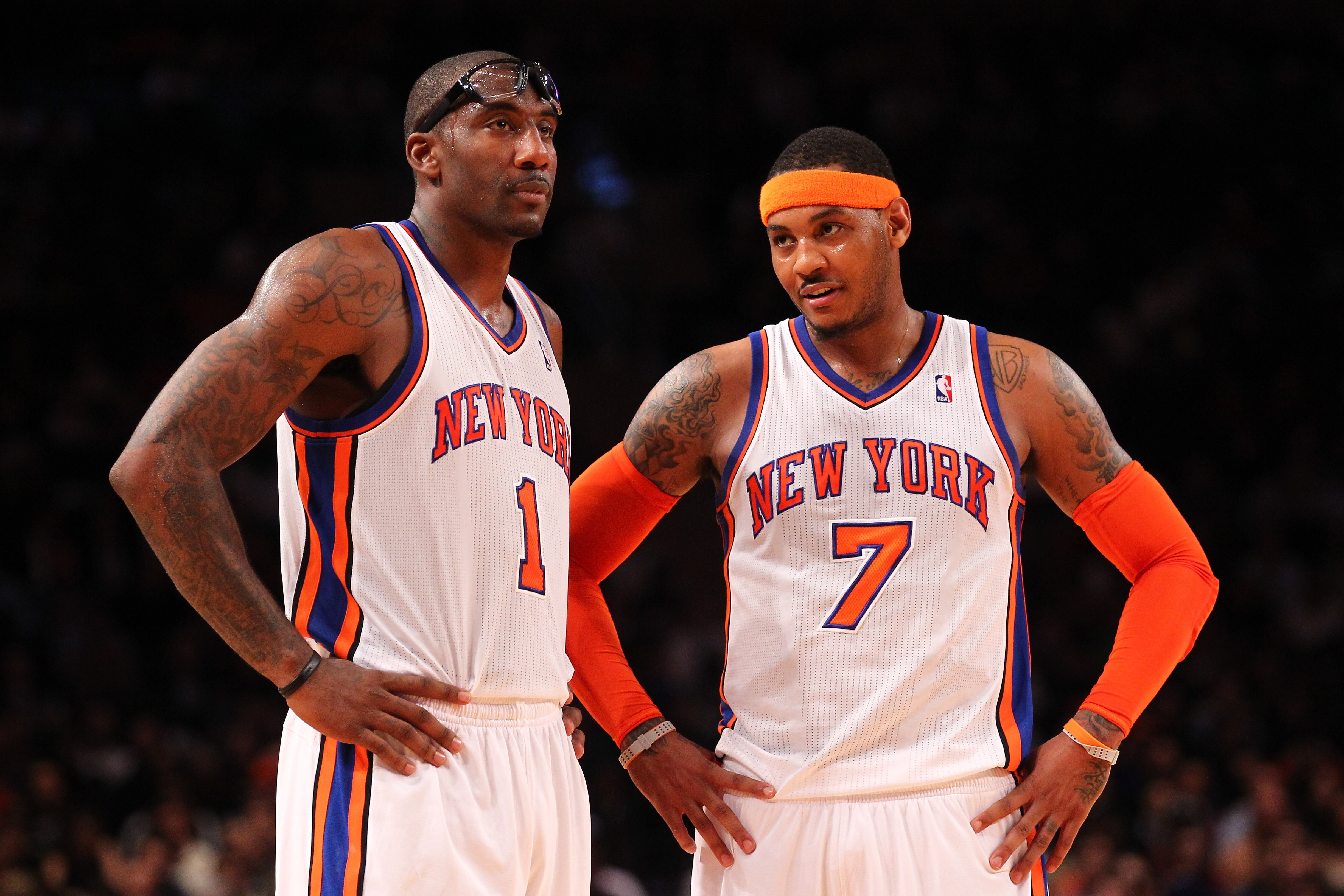 NEW YORK, NY - DECEMBER 21: Amare Stoudemire #1 , and Carmelo Anthony #7 of the New York Knicks talk during their pre season game against the New Jersey Nets at Madison Square Garden on December 21, 2011 in New York City. NOTE TO USER: User expressly acknowledges and agrees that, by downloading and or using this photograph, User is consenting to the terms and conditions of the Getty Images License Agreement. (Photo by Al Bello/Getty Images)
