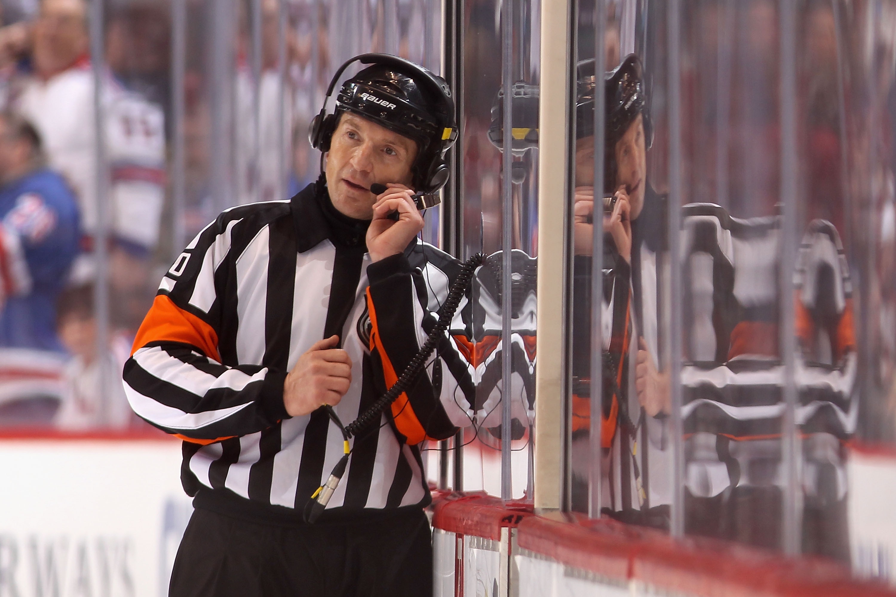 GLENDALE, AZ - DECEMBER 17: Referre Tim Peel talks with NHL officials in Toronto as they review Brad Richards #19 of the New York Rangers goal in the final second during the NHL game against the Phoenix Coyotes at Jobing.com Arena on December 17, 2011 in Glendale, Arizona. The Rangers defeated the Coyotes 3-2. (Photo by Christian Petersen/Getty Images)