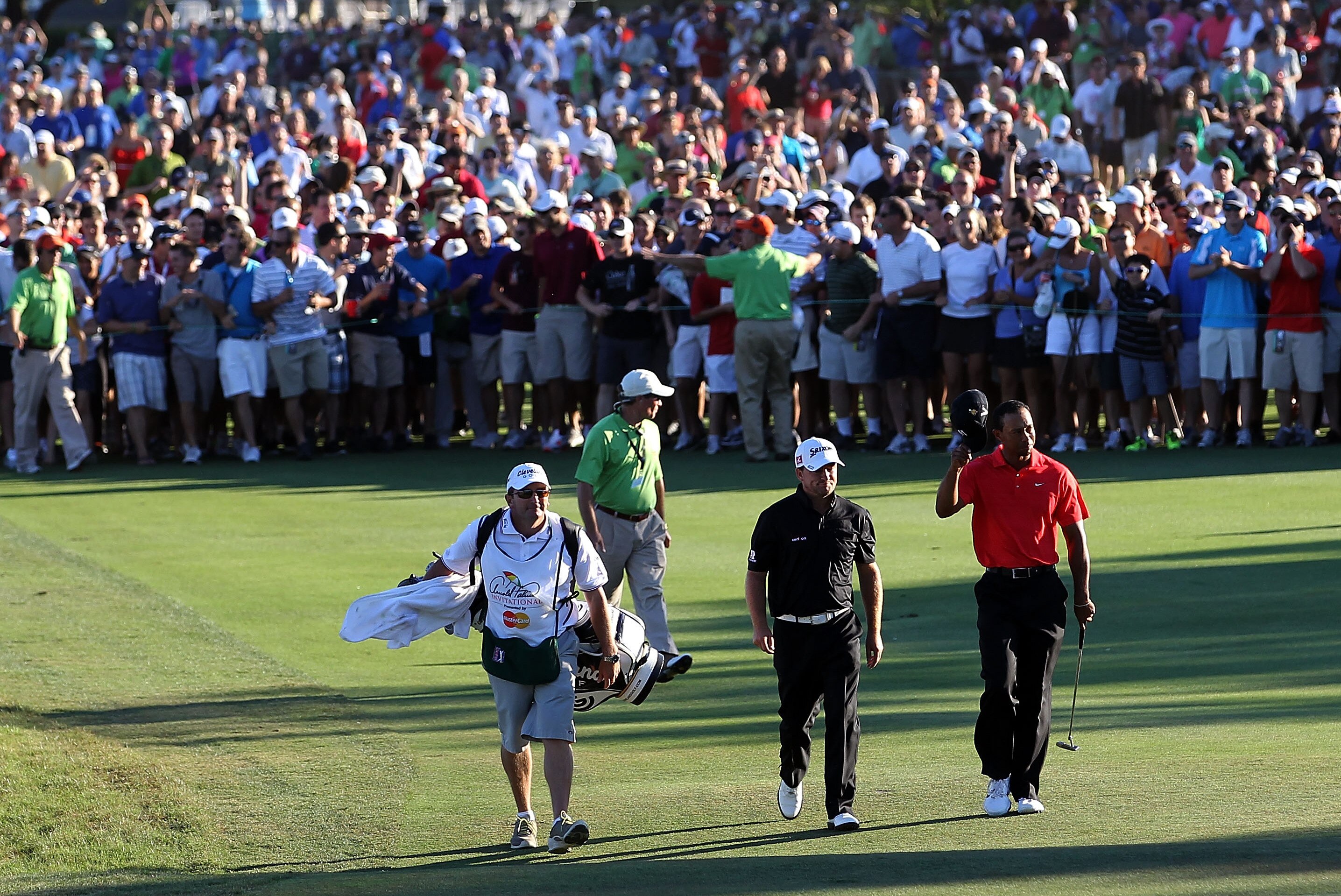 ORLANDO, FL - MARCH 25: Tiger Woods and Graeme McDowell walk down the 18th hole during the final round of the Arnold Palmer Invitational presented by MasterCard at the Bay Hill Club and Lodge on March 25, 2012 in Orlando, Florida. (Photo by Sam Greenwood/Getty Images)