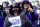 BALTIMORE, MD - JANUARY 15:  Fans of the Baltimore Ravens cheer prior to the start of the AFC Divisional playoff game against the Houston Texans at M&T Bank Stadium on January 15, 2012 in Baltimore, Maryland.  (Photo by Rob Carr/Getty Images)