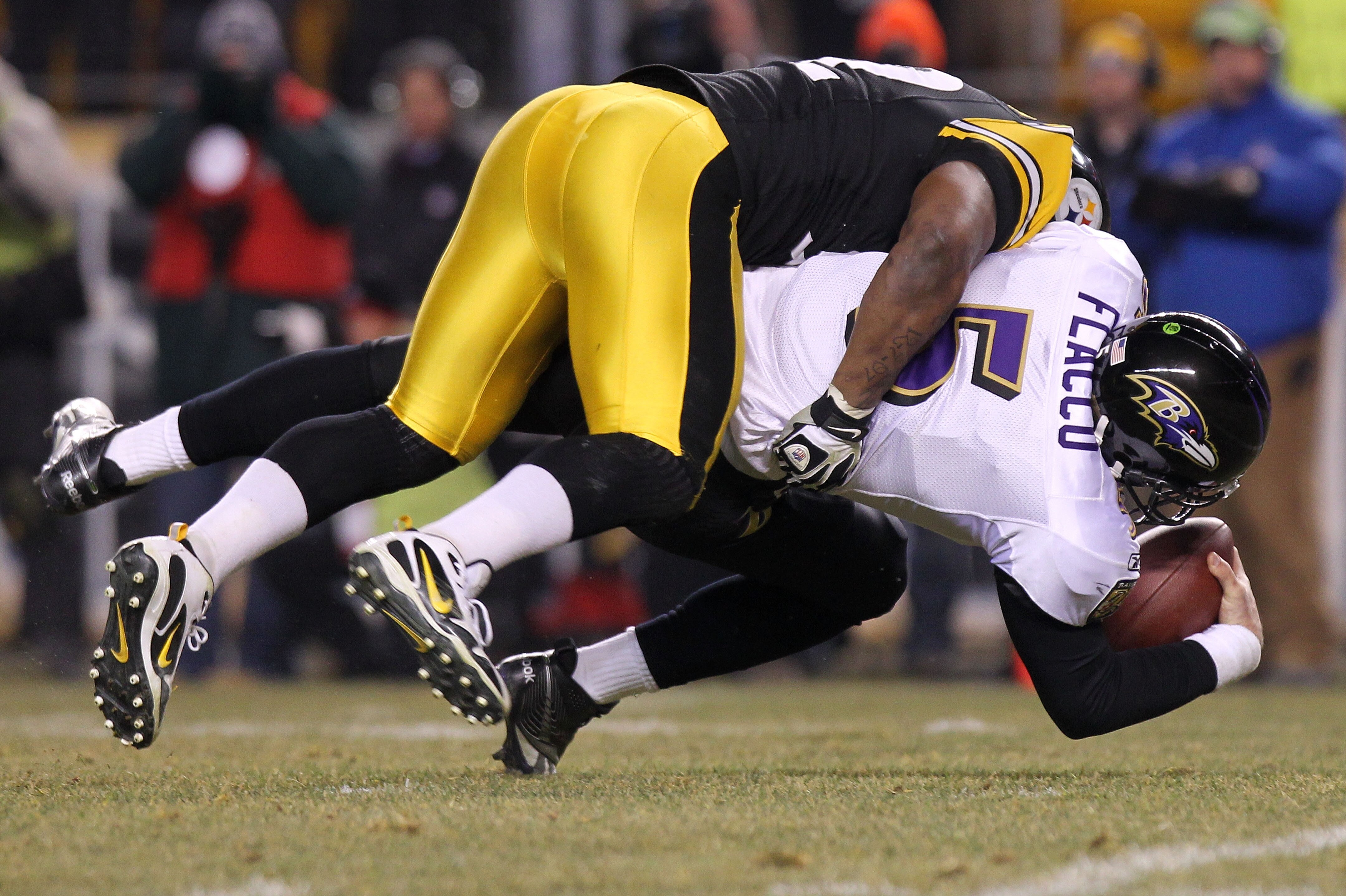 PITTSBURGH, PA - JANUARY 15: Linebacker James Harrison #92 of the Pittsburgh Steelers sacks quarterback Joe Flacco #5 of the Baltimore Ravens during the AFC Divisional Playoff Game at Heinz Field on January 15, 2011 in Pittsburgh, Pennsylvania. (Photo by Nick Laham/Getty Images)